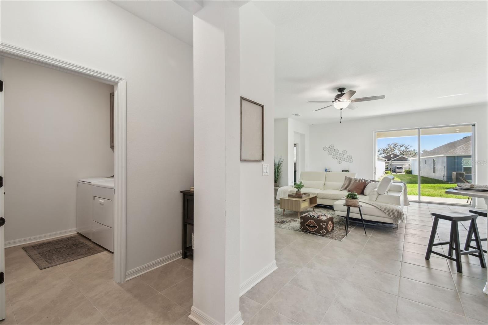 Hallway leading to laundry room and garage