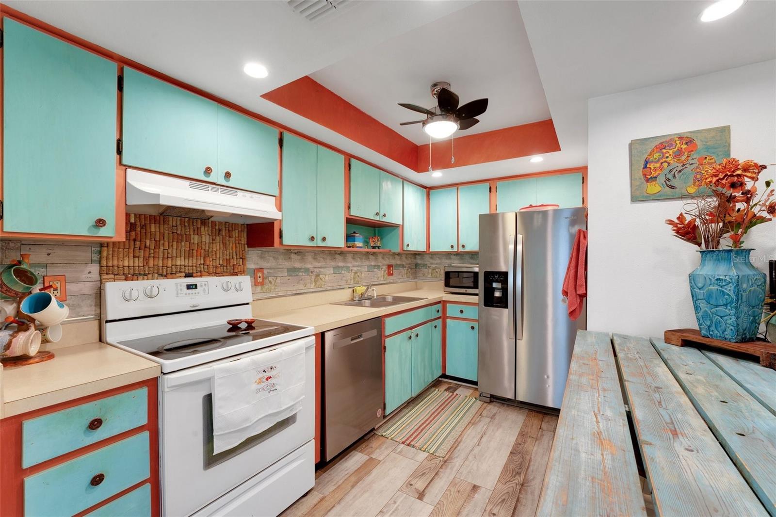 Galley style kitchen with eat in space and plenty of cabinets!