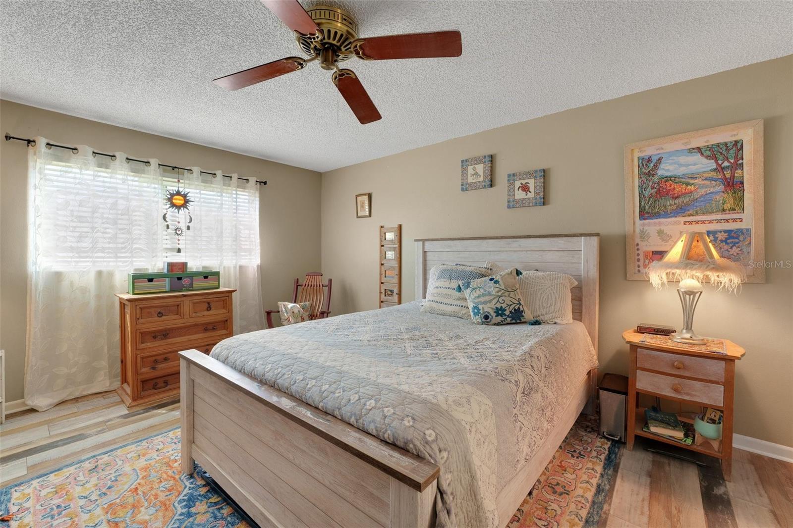 This generously sized master bedroom comfortably accommodates either king or queen-sized furnishings, offering plenty of space for relaxation and personalization. For added convenience and privacy, the room features its own en suite bath.