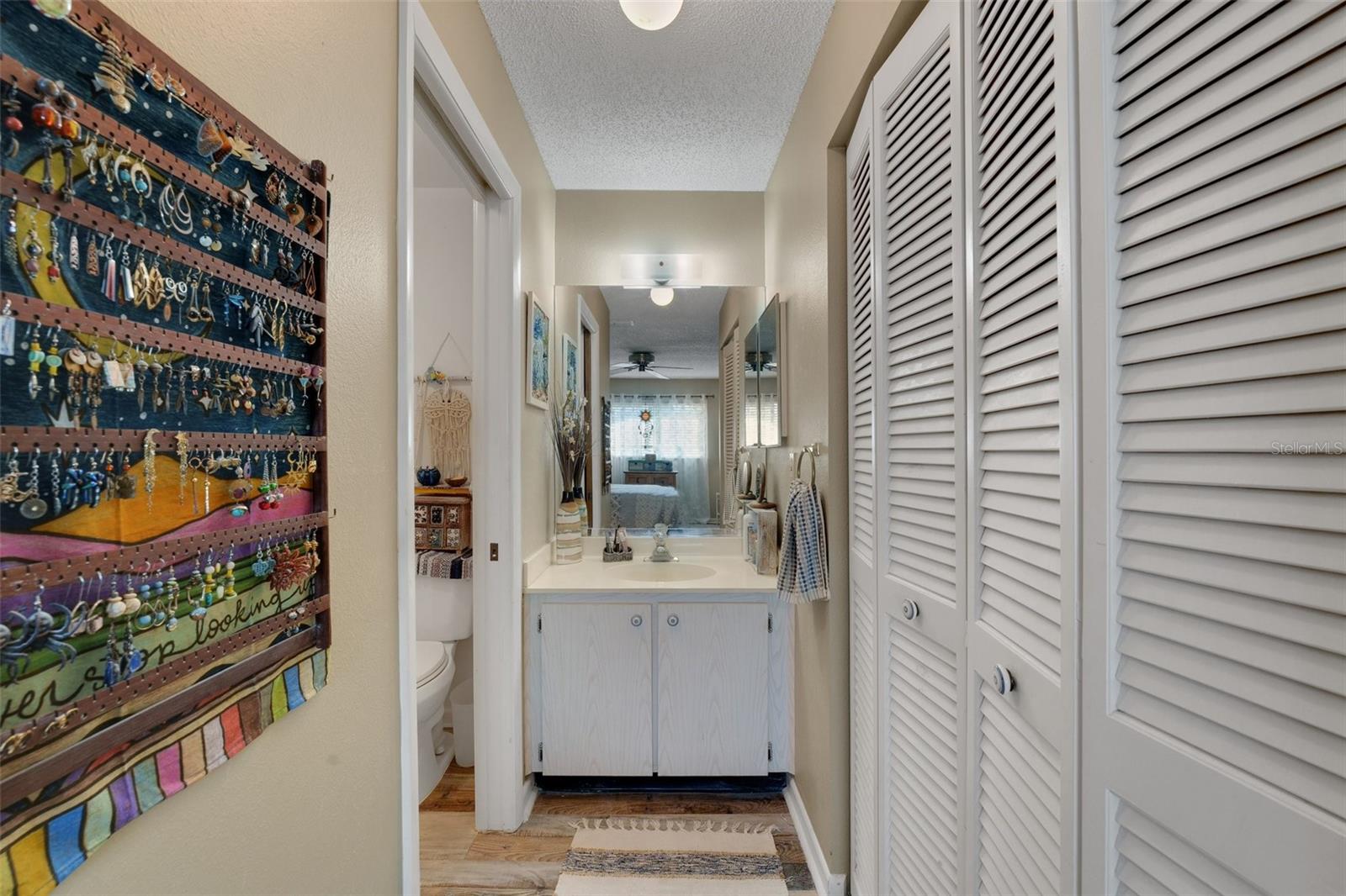 The hallway offers a sense of separation, ensuring privacy while moving seamlessly between the bedroom and bath.