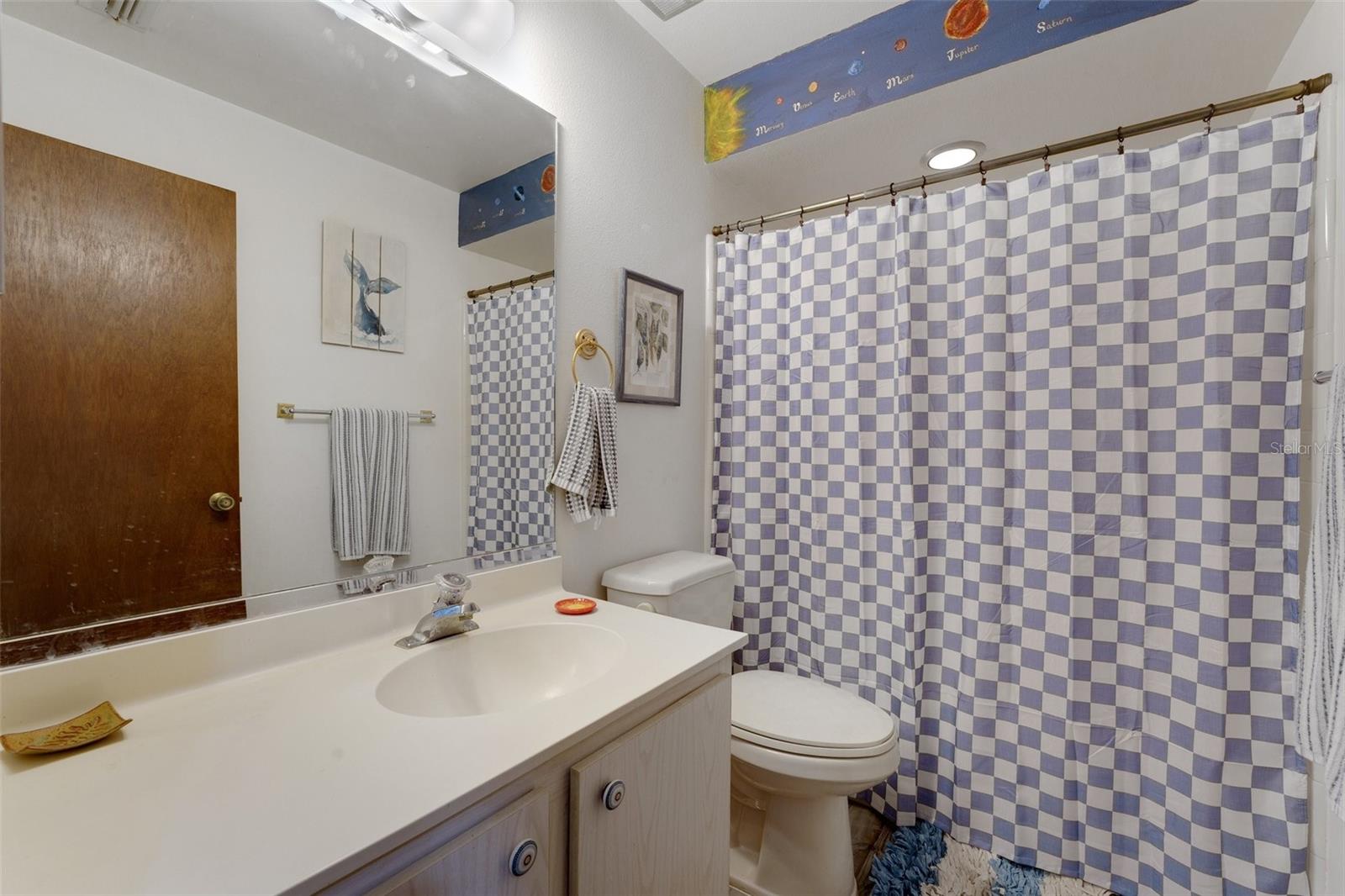 The home features a full second bath, thoughtfully located just steps away from the second bedroom.