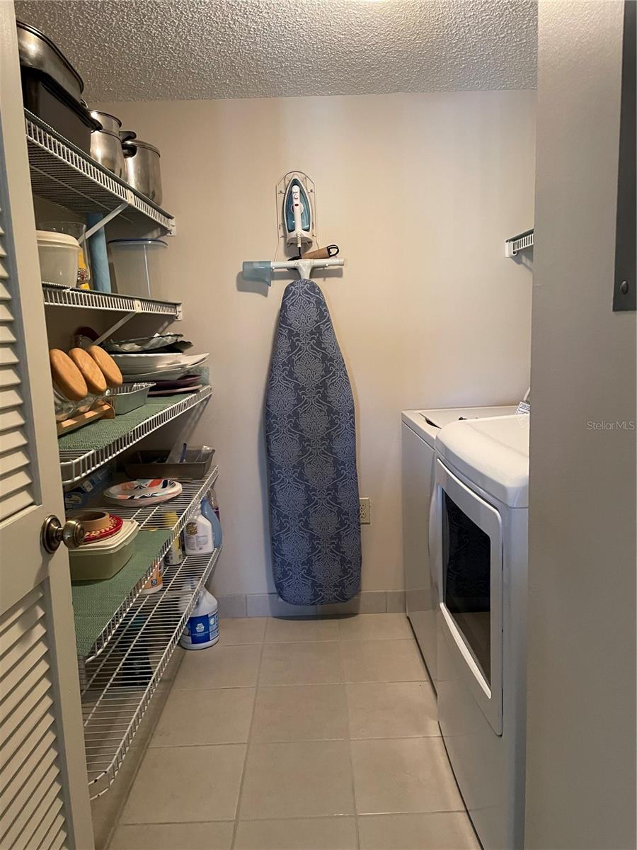 Laundry with storage shelves