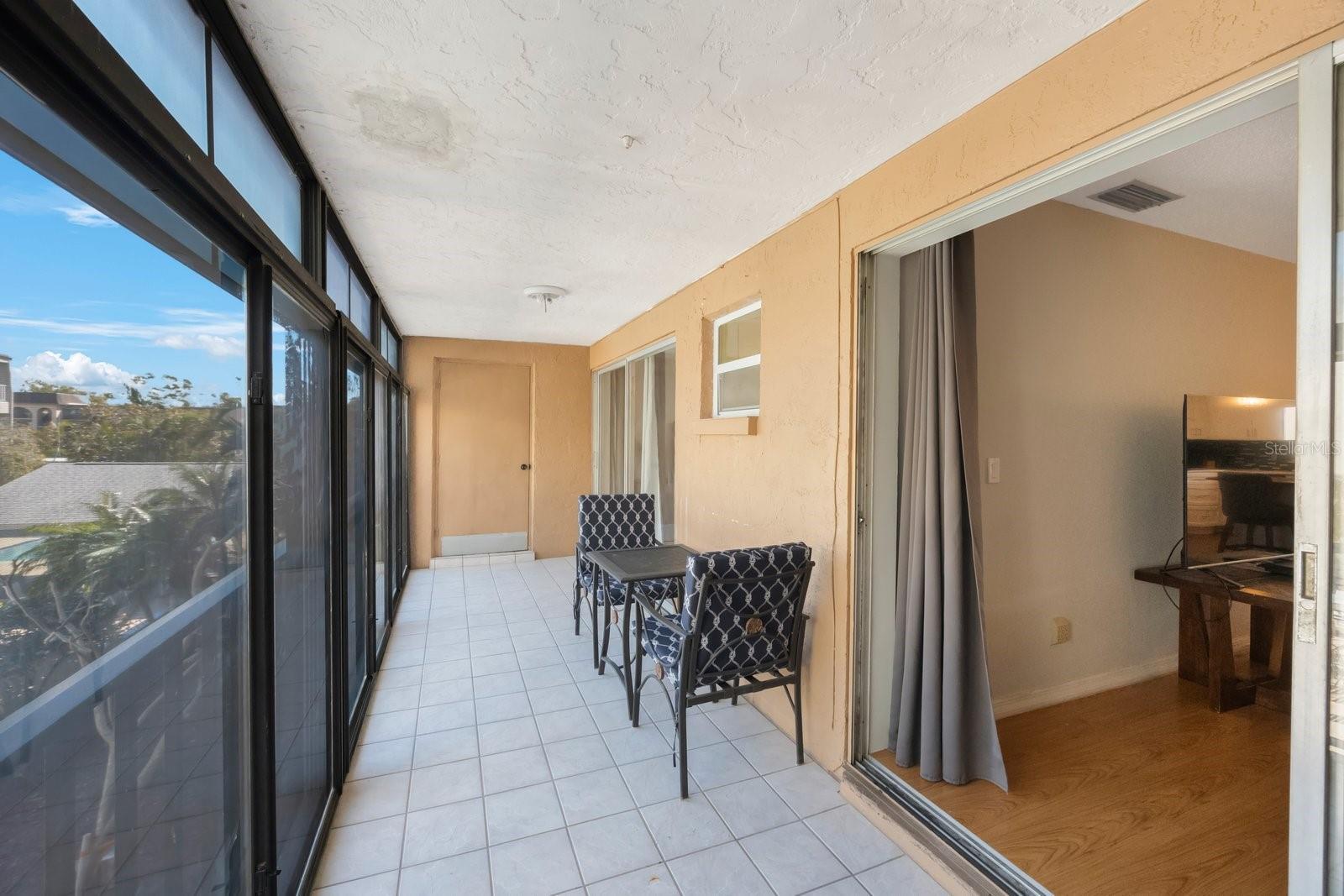 Enclosed Balcony overlooking the Pool