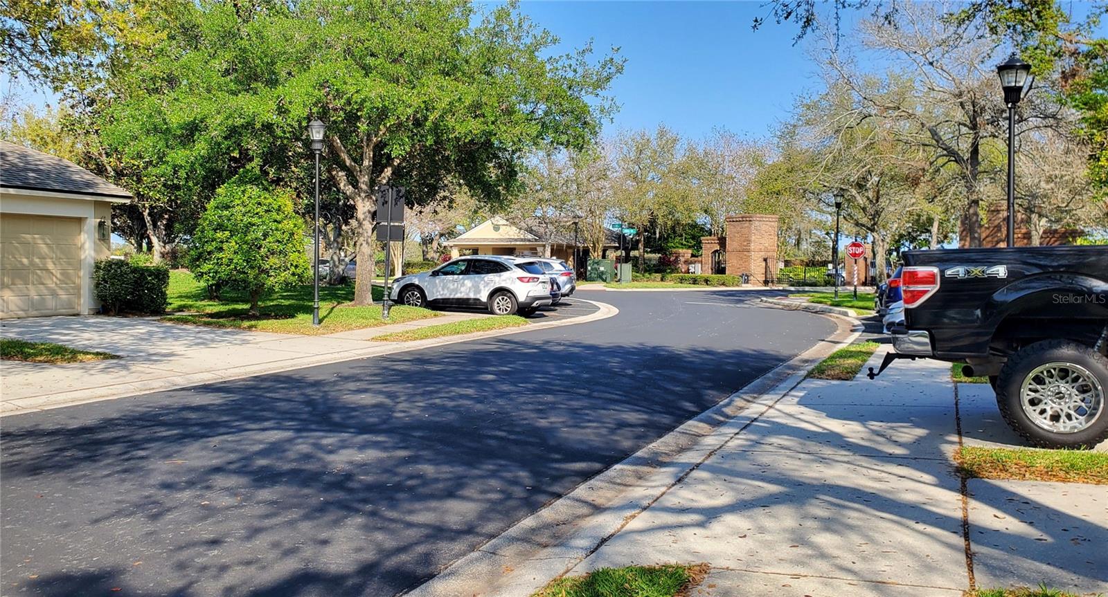 View looking from your driveway towards the POOL with GUEST parking to the right & left.