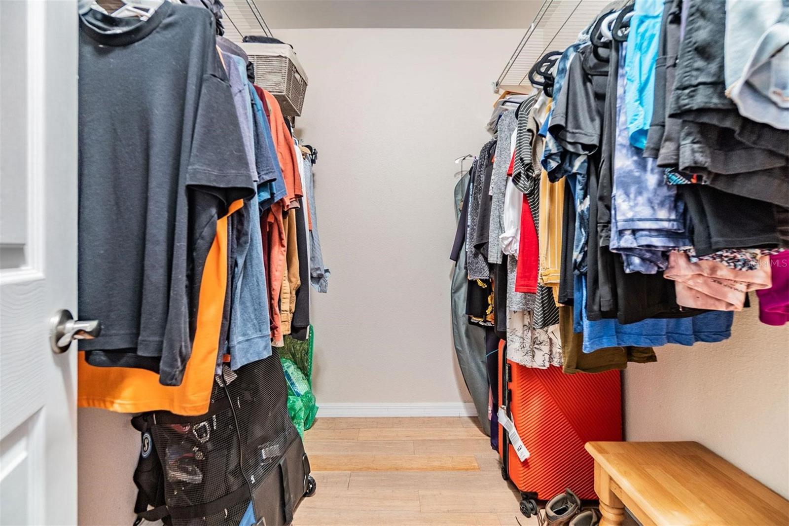 Walk-in closet in the primary bedroom.