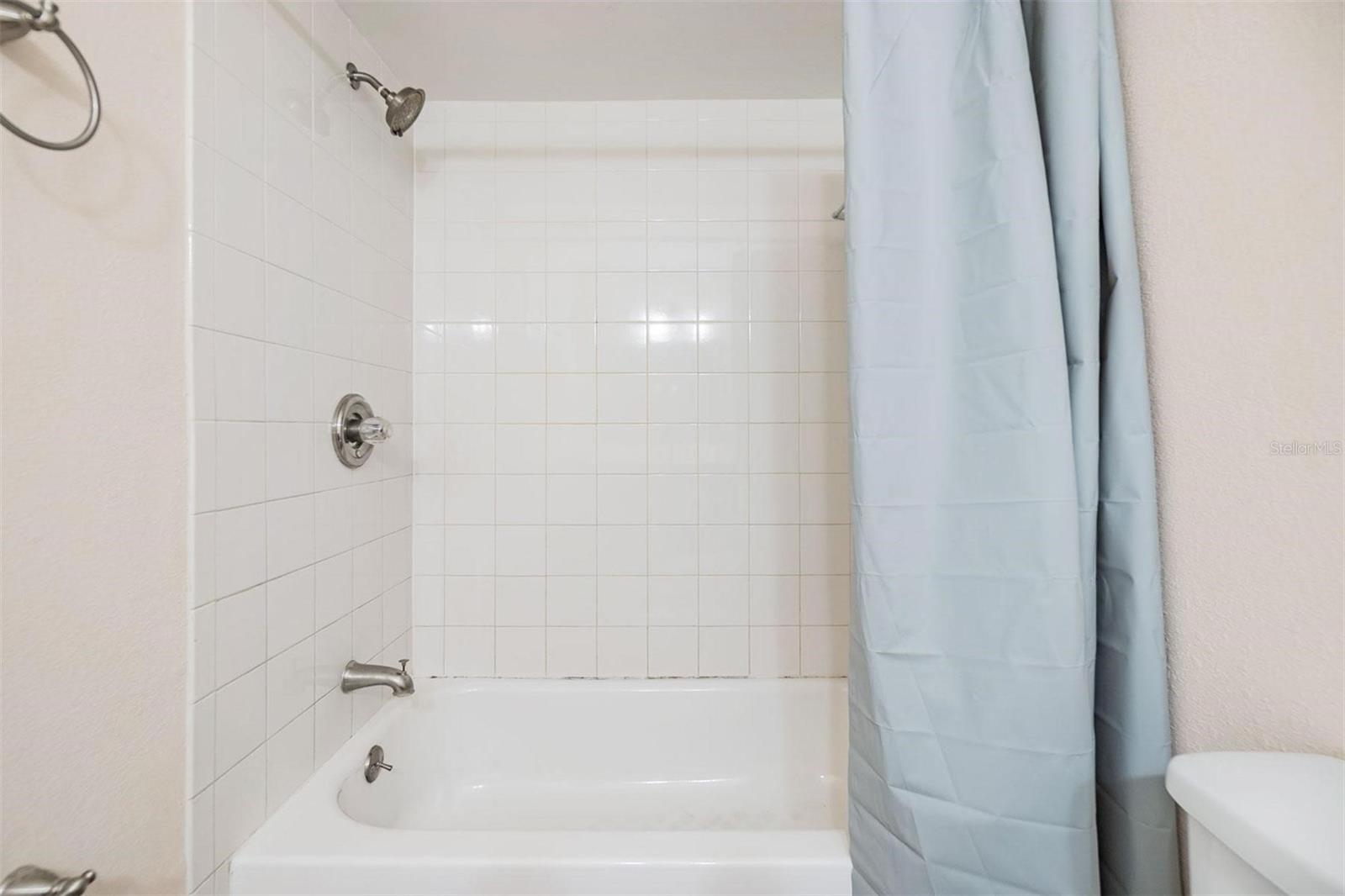 Second bathroom with stylish vanity and shower/tub