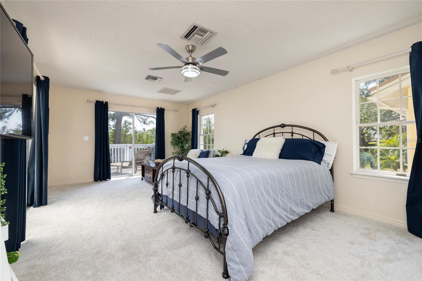 Secondary Master Bedroom with access to pool and sundeck