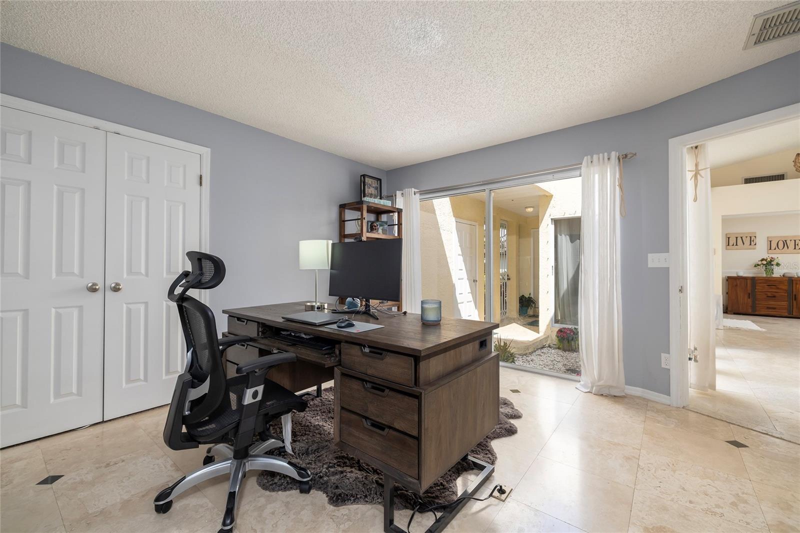 Fourth Bedroom (sliders lead to private courtyard at front entrance)