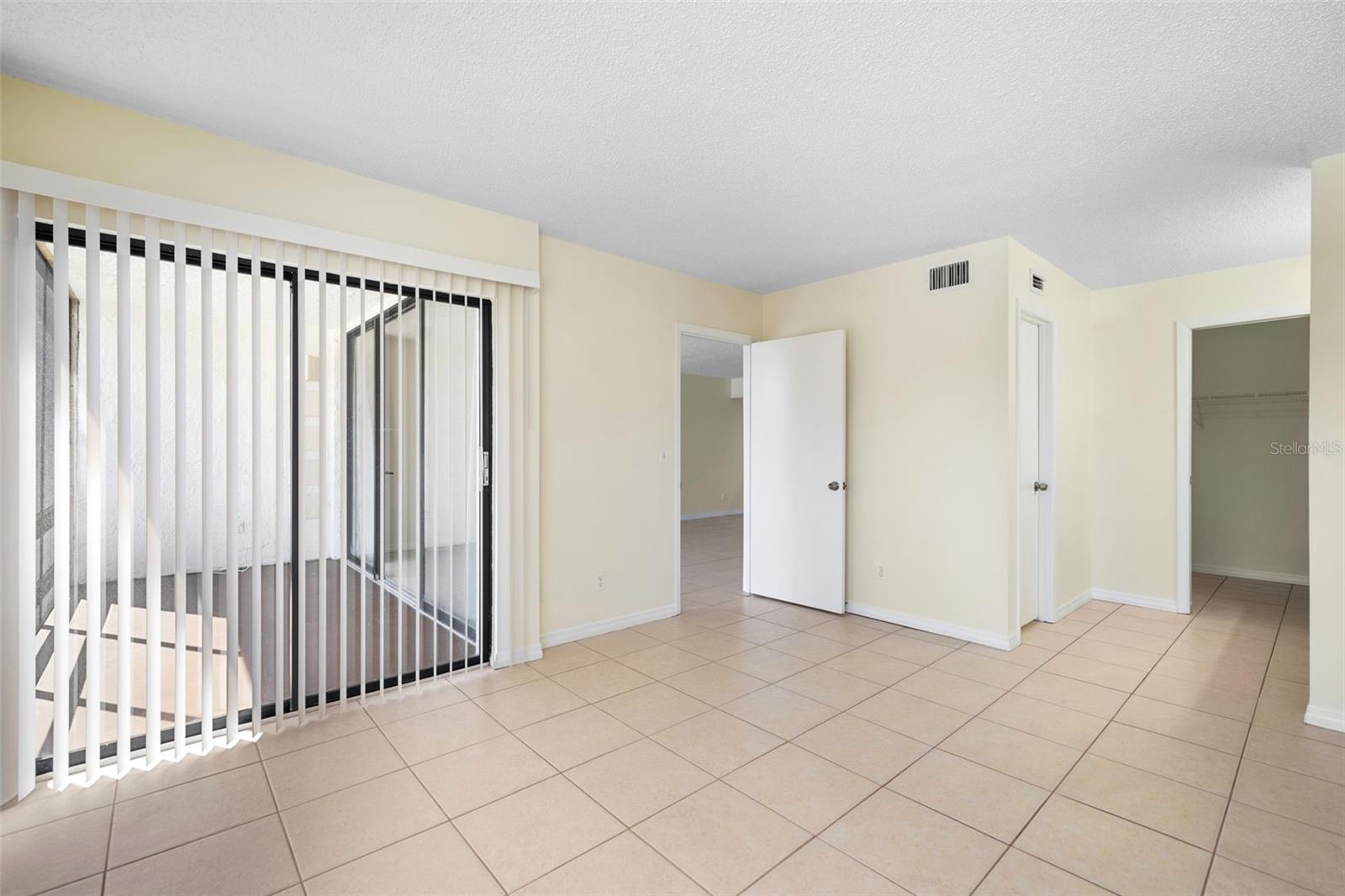 Sliding door to balcony in primary bedroom