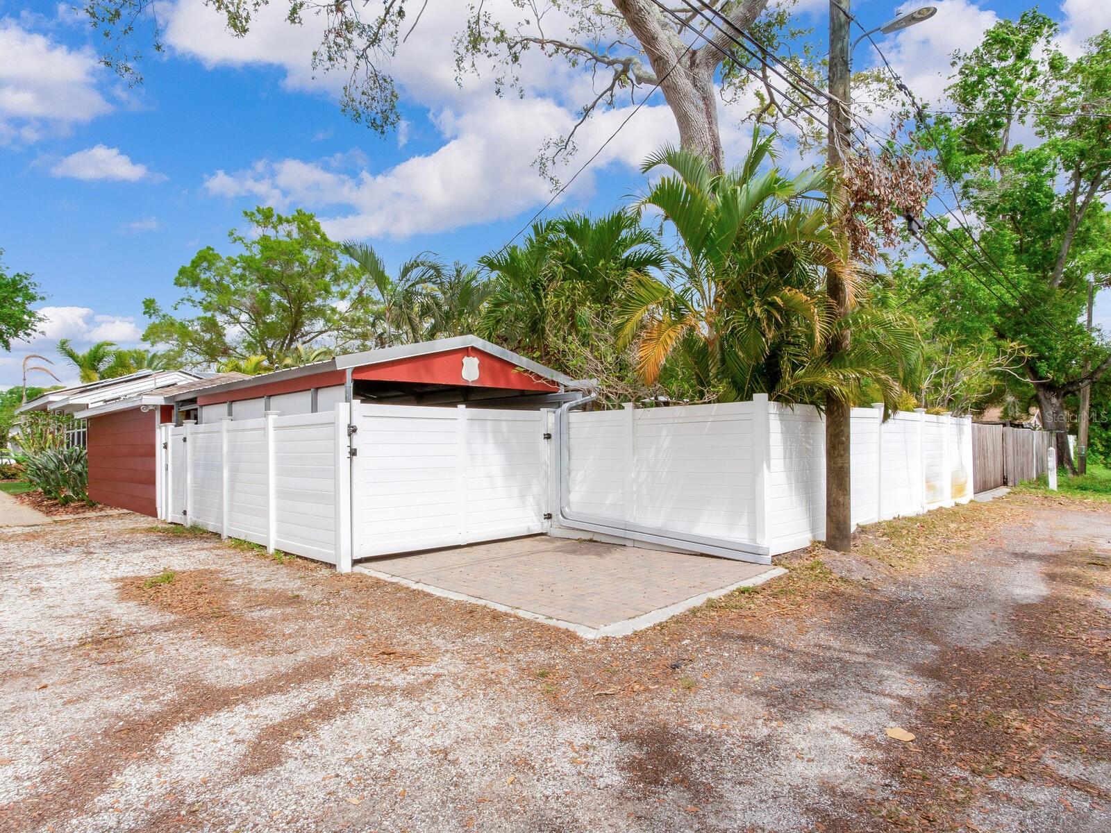 Back of the house. Covered 1-Car Garage