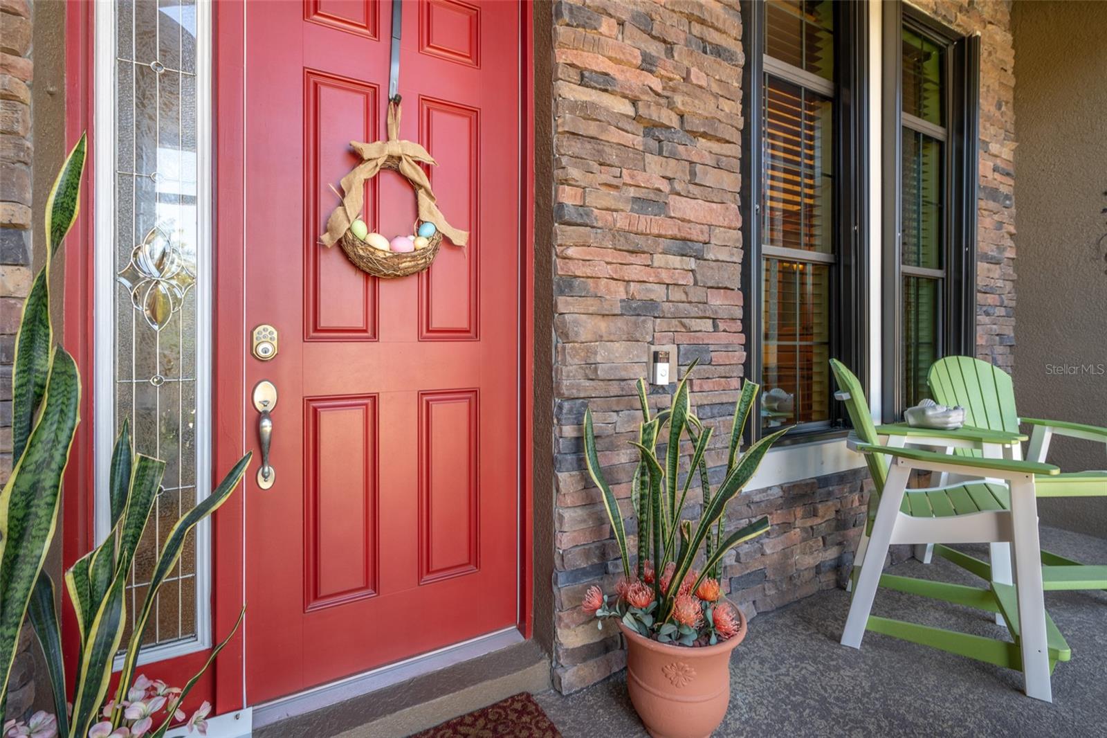 INVITING ENTRANCE WITH BRICK ACCENTS