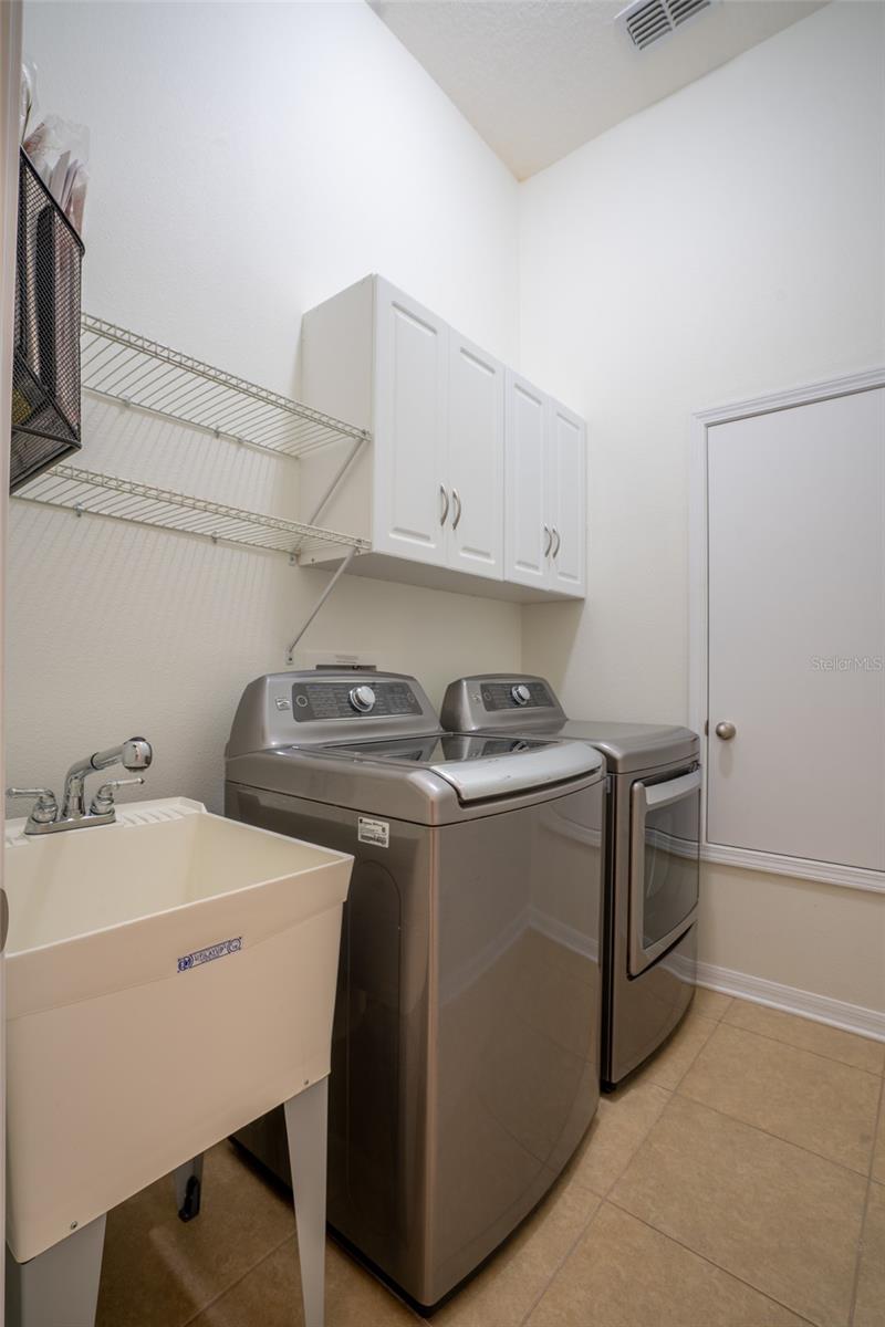 LAUNDRY ROOM WITH BUILT IN CABINETS & UTILITY SINK