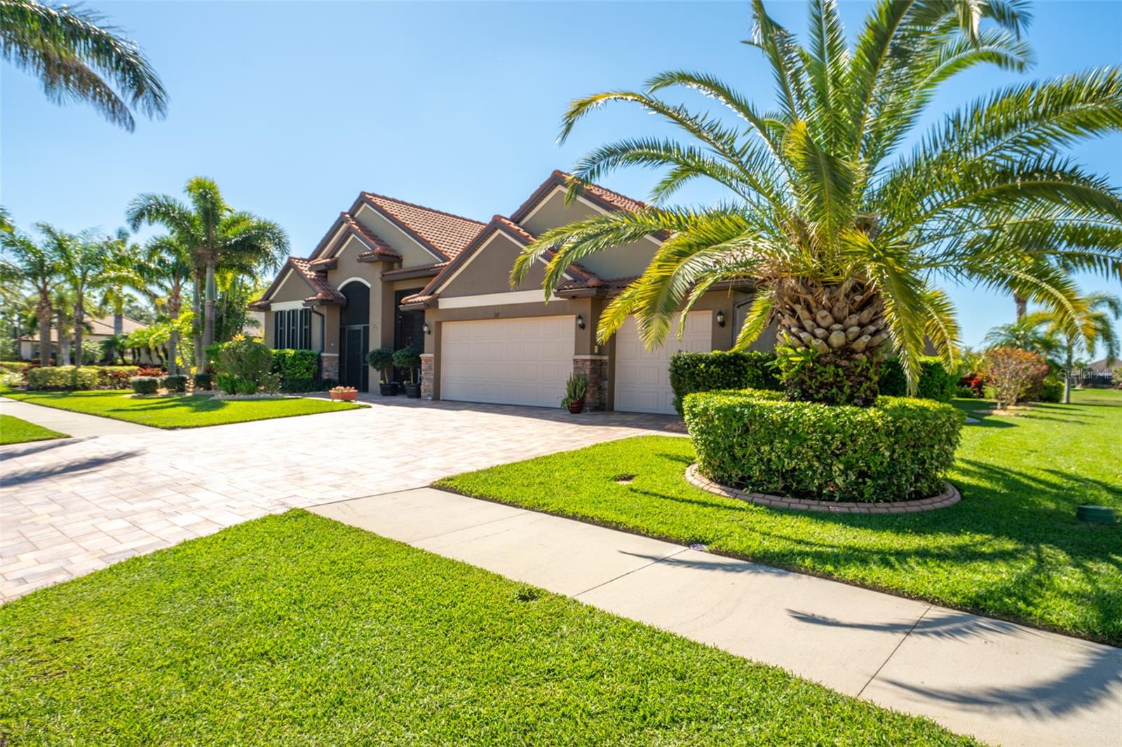 BRICK PAVERES COMPLETE THE EXTENSIVE DRIVEWAY