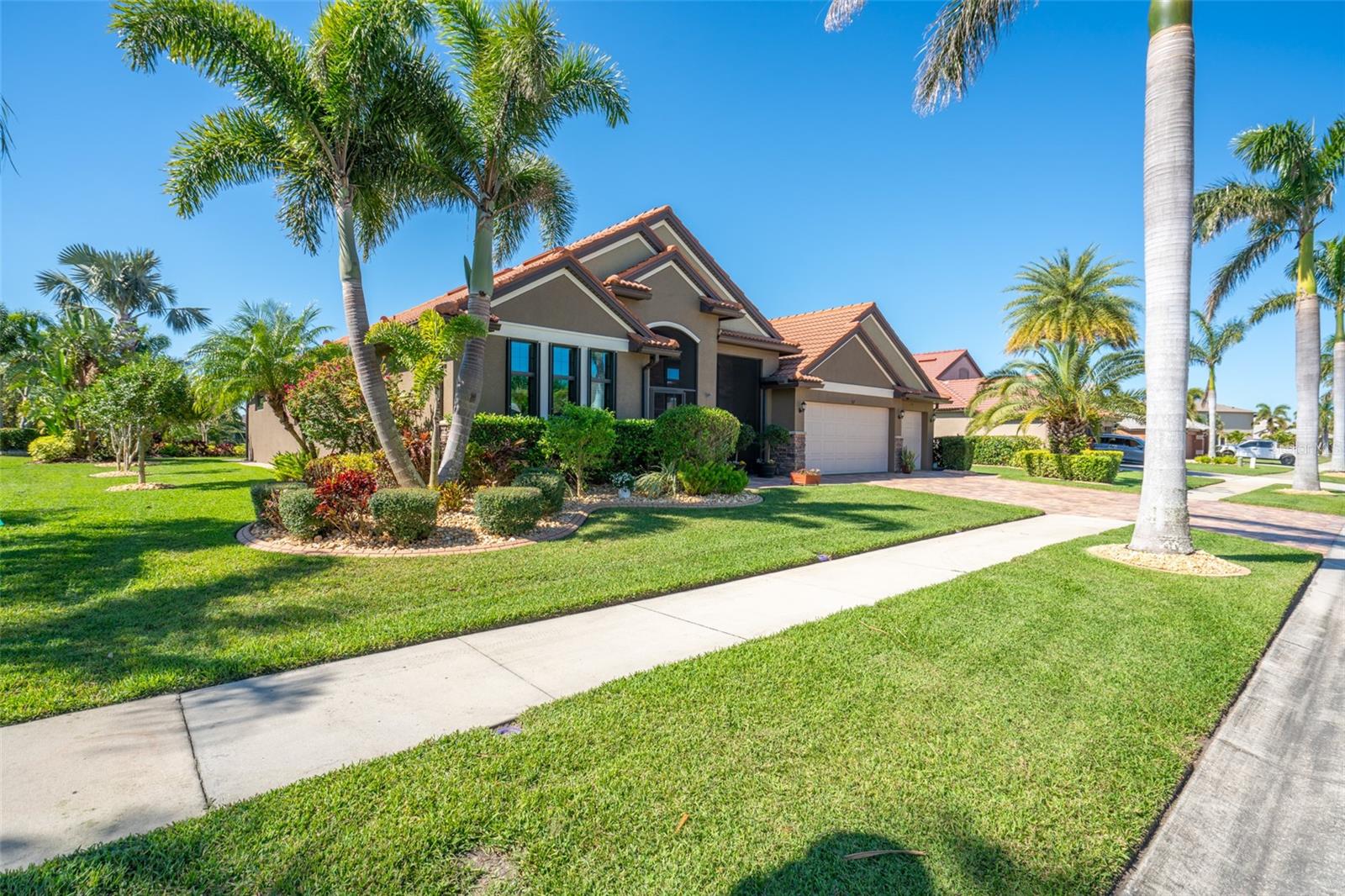 DECORATIVE CURBING & STONES COMPLETE THE FRONT & SIDES OF THE HOME.