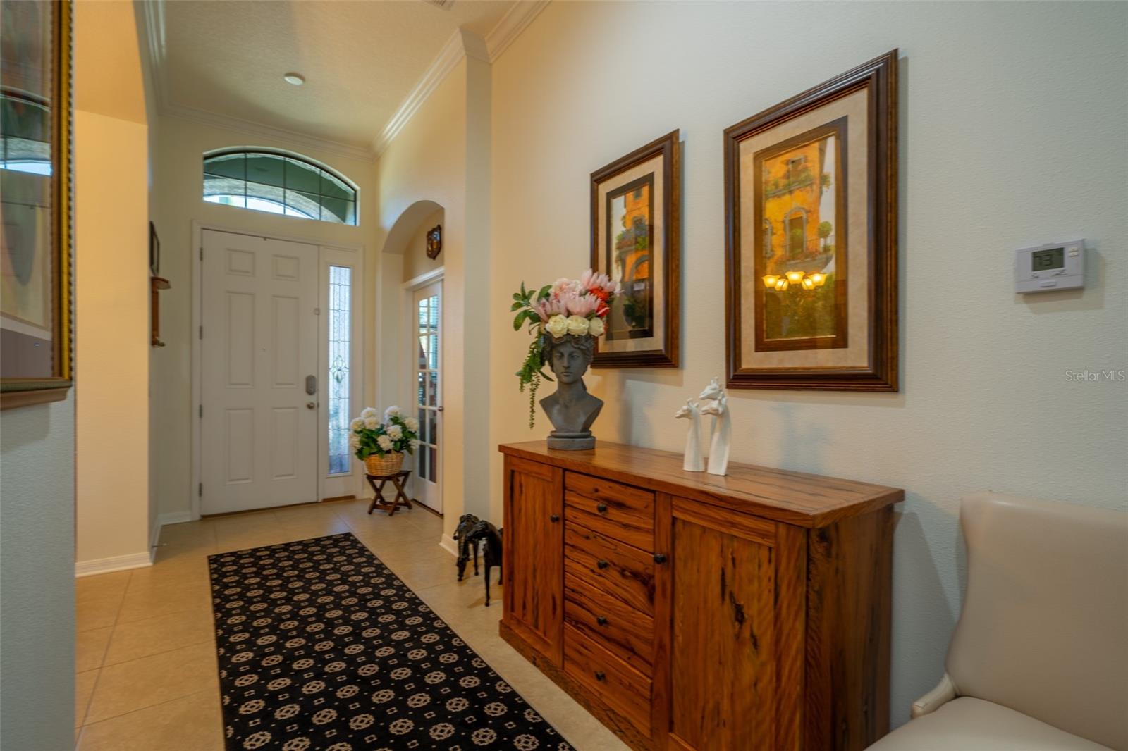 LARGE FOYER WELCOMES YOU INTO THE HOME