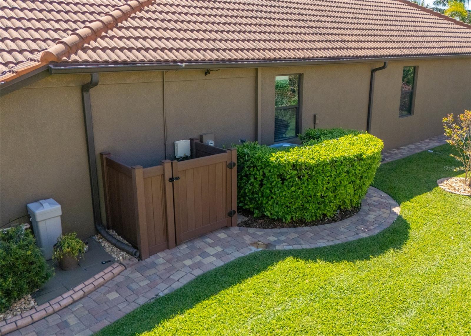 EVEN THE SIDES OF THE HOME HAVE PAVED SIDEWALK