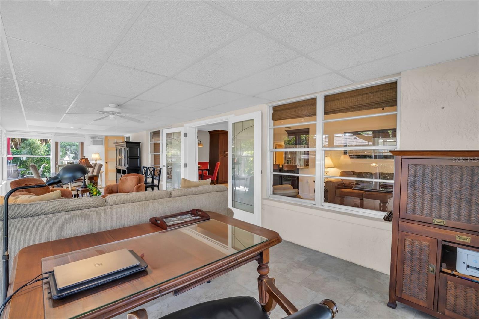 Gorgeous glass double doors between the open & main living to the Florida room~