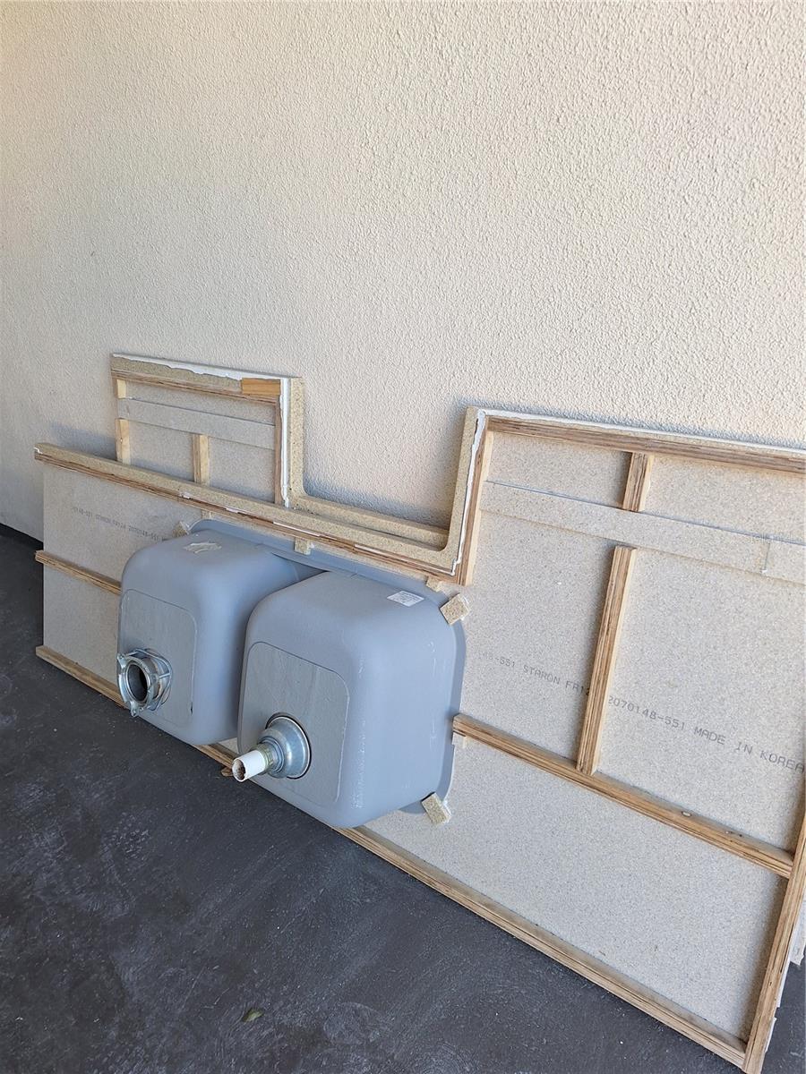 NEWER SINKS BEING STORED WITH STONE COUNTERTOPS