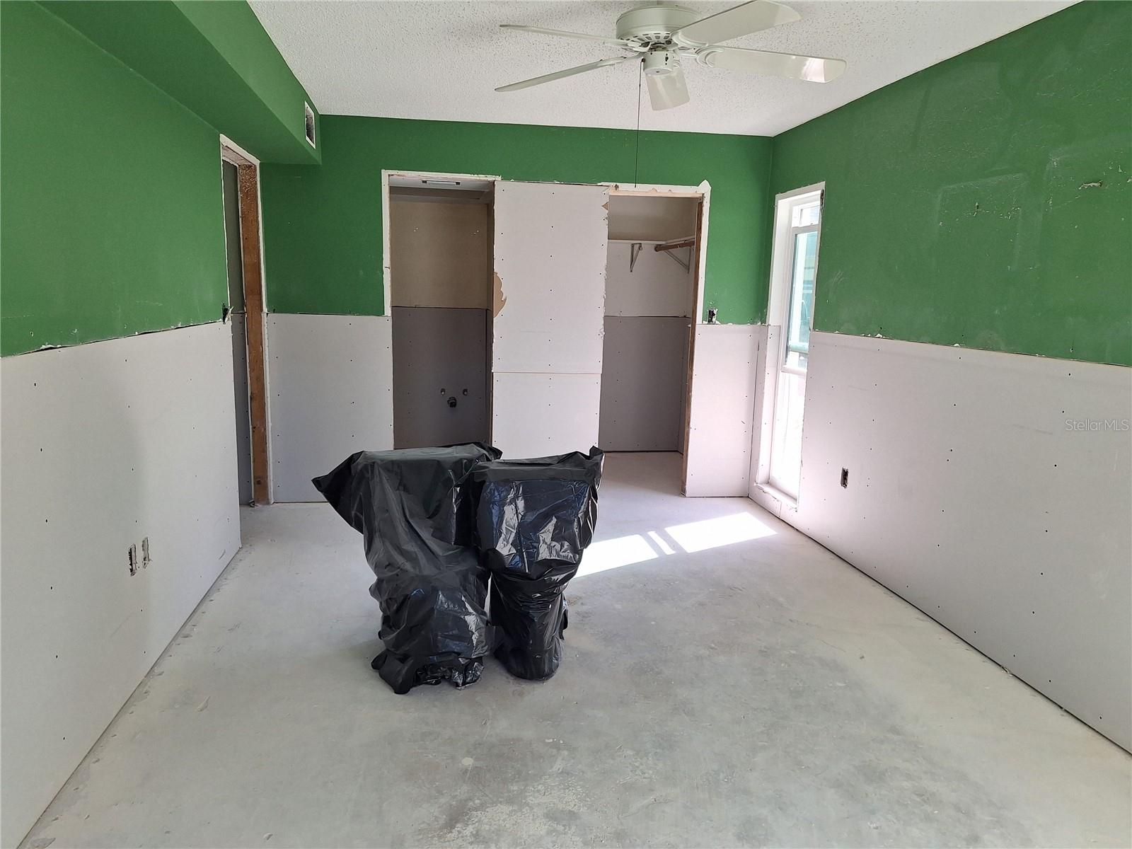 BIG PRIMARY BEDROOM-NEWER TOILETS UNDER PLASTIC