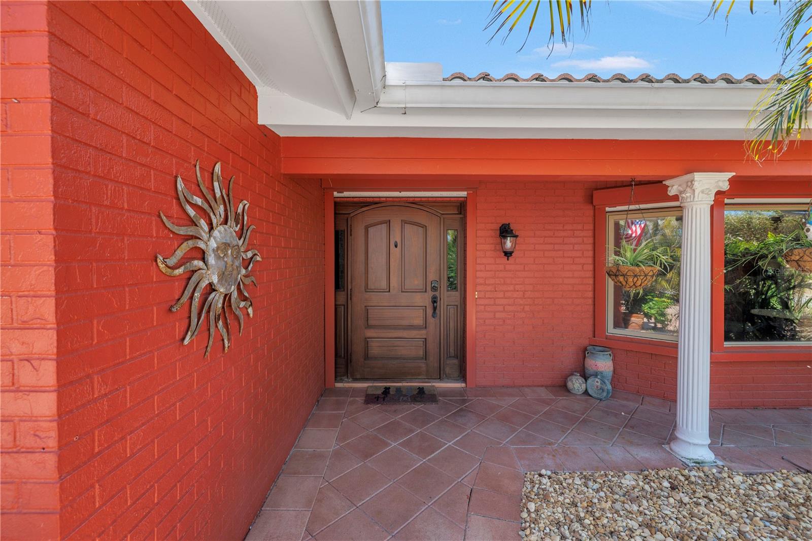 Front entry way offers a covered patio.