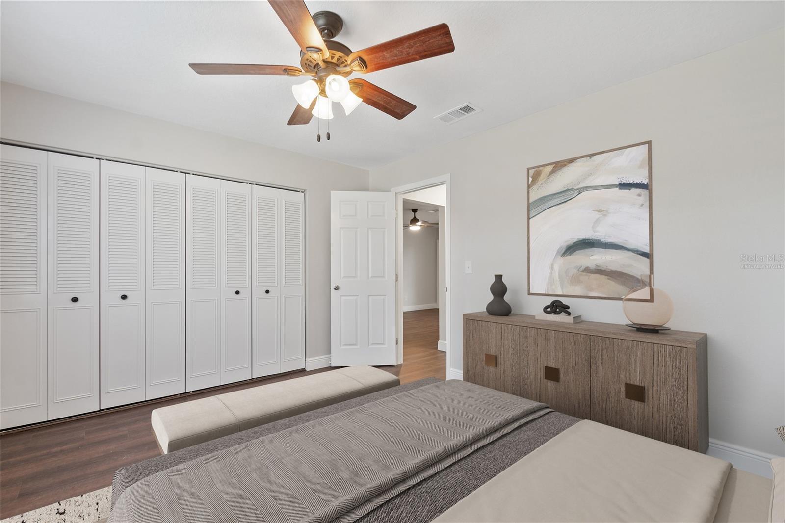 Virtually staged master bedroom/ double closet