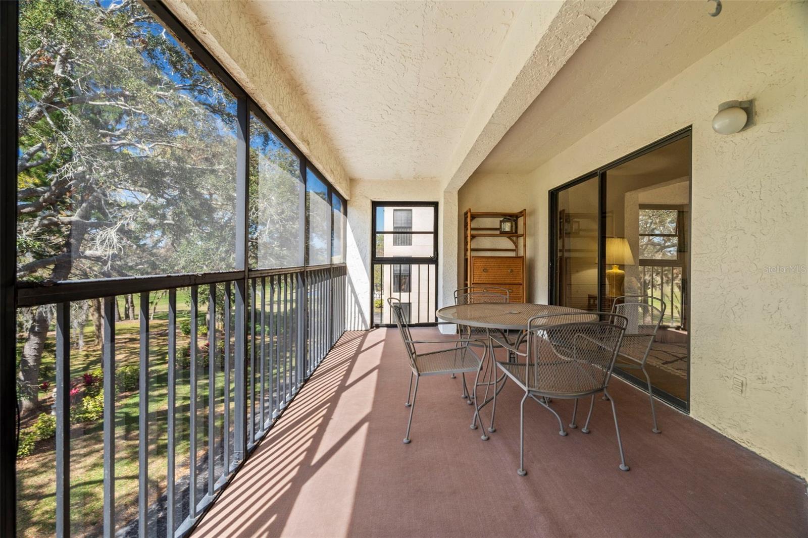 Screened in balcony with sliders to family room