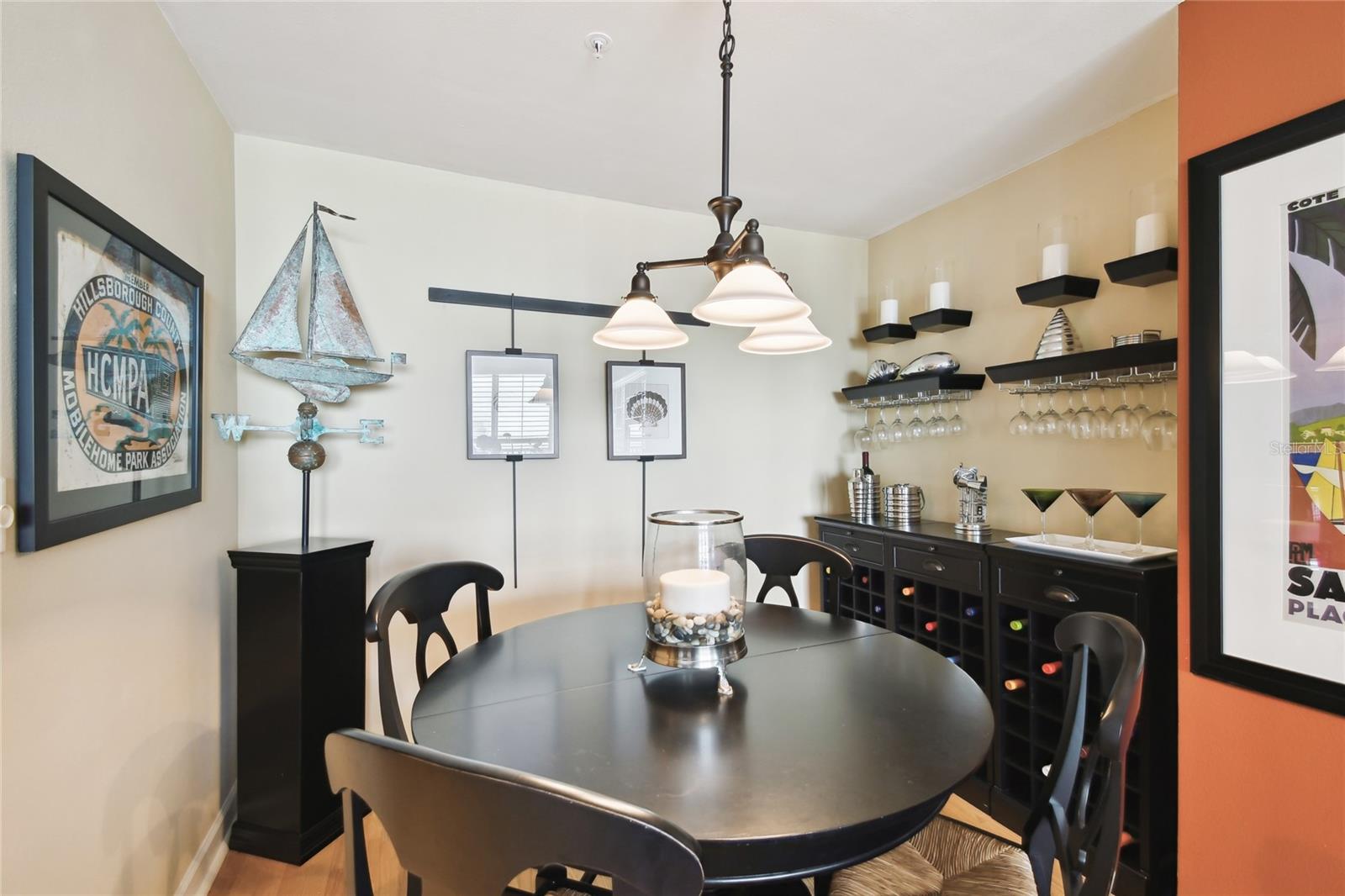 Charming dining area with built-in wine storage and decor.