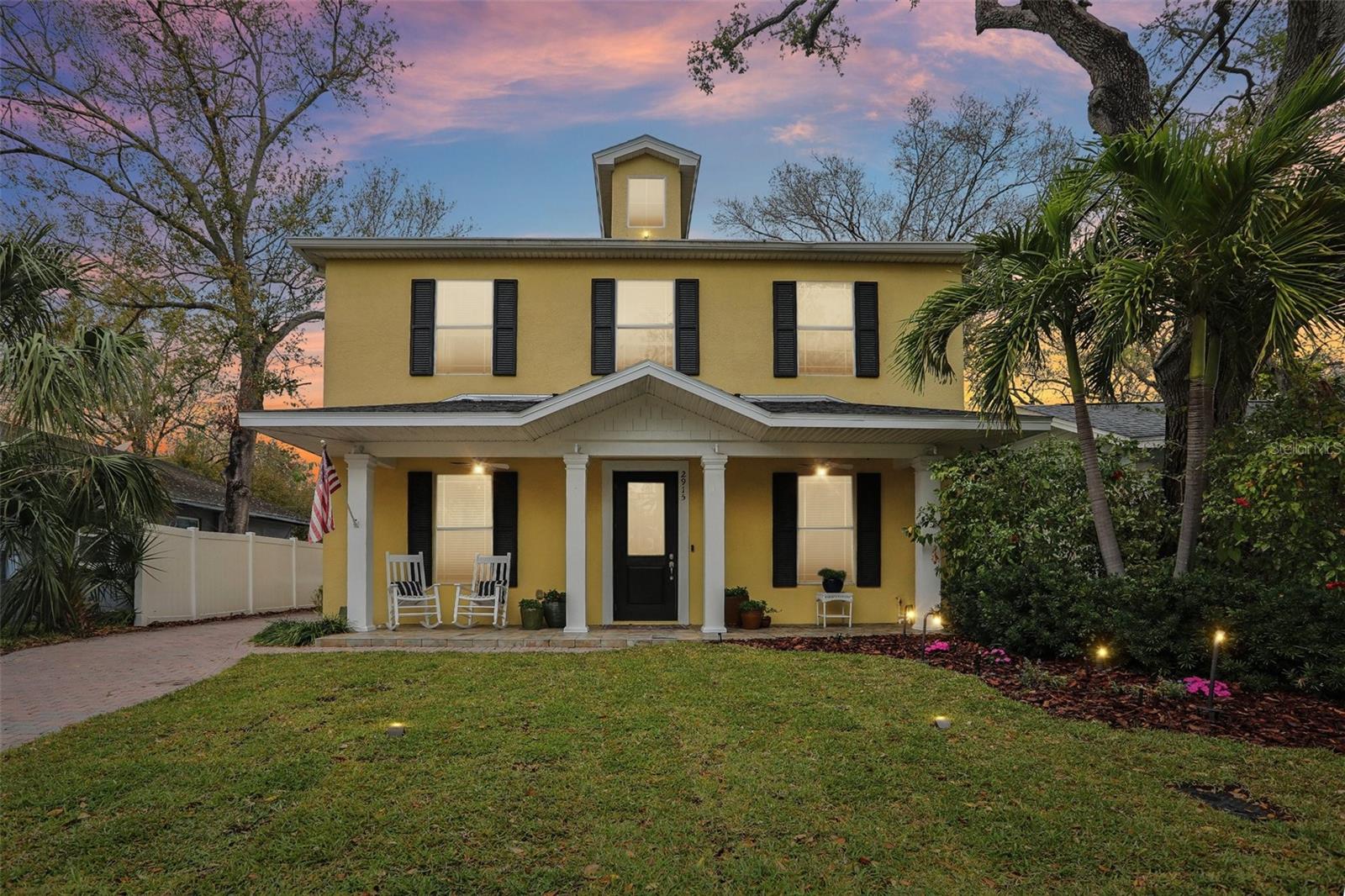 Front at dusk w/ landscape lighting