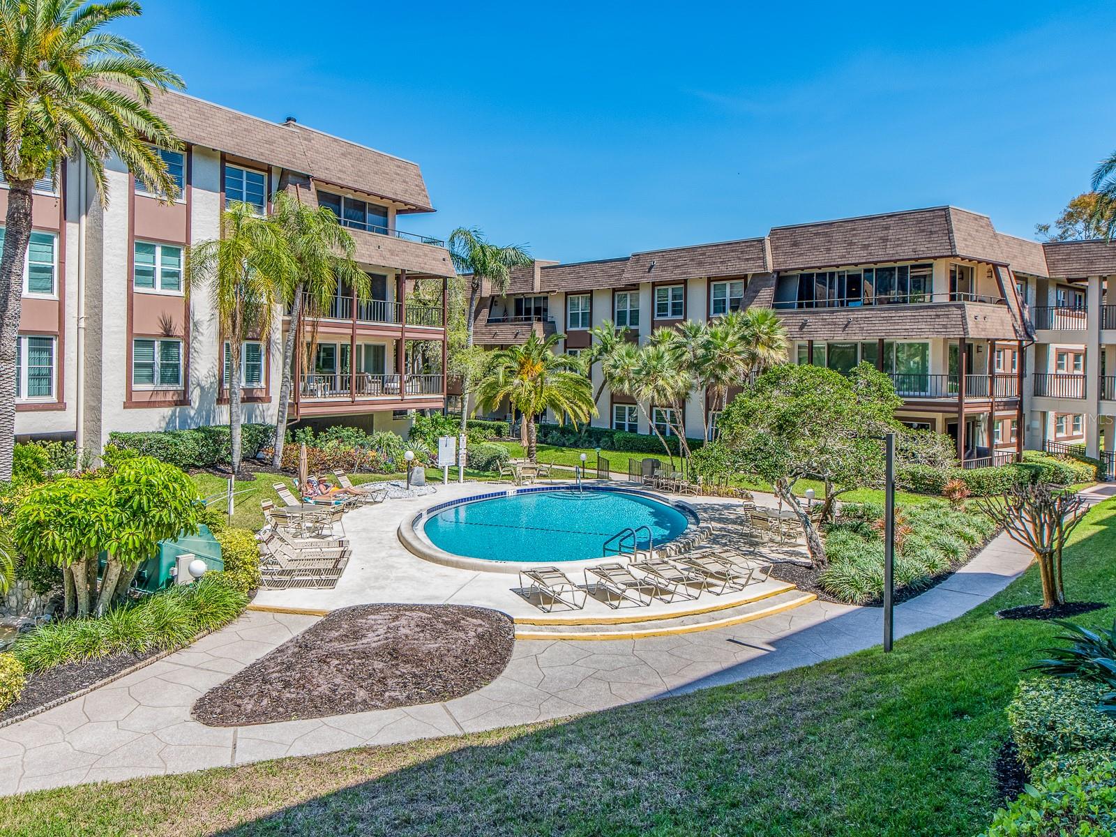 BALCONY VIEWS OF THE COMMUNITY POOL AND SCENIC LANDSCAPE