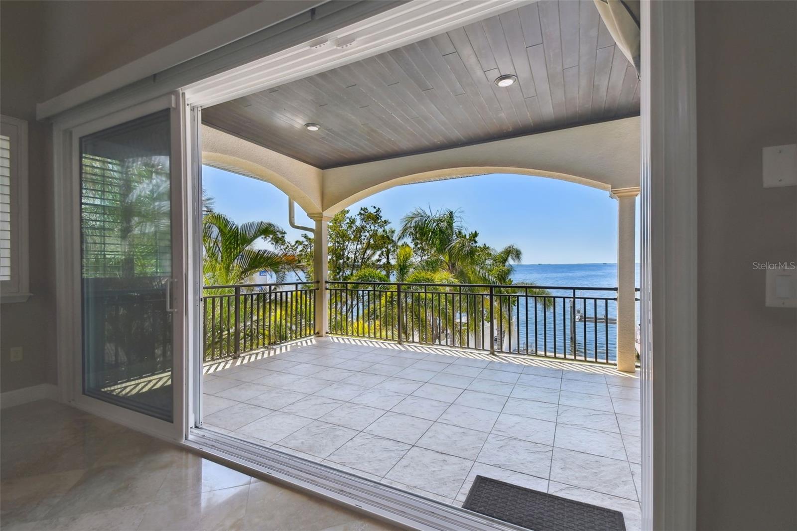 Expansive Covered Balcony across back of home.