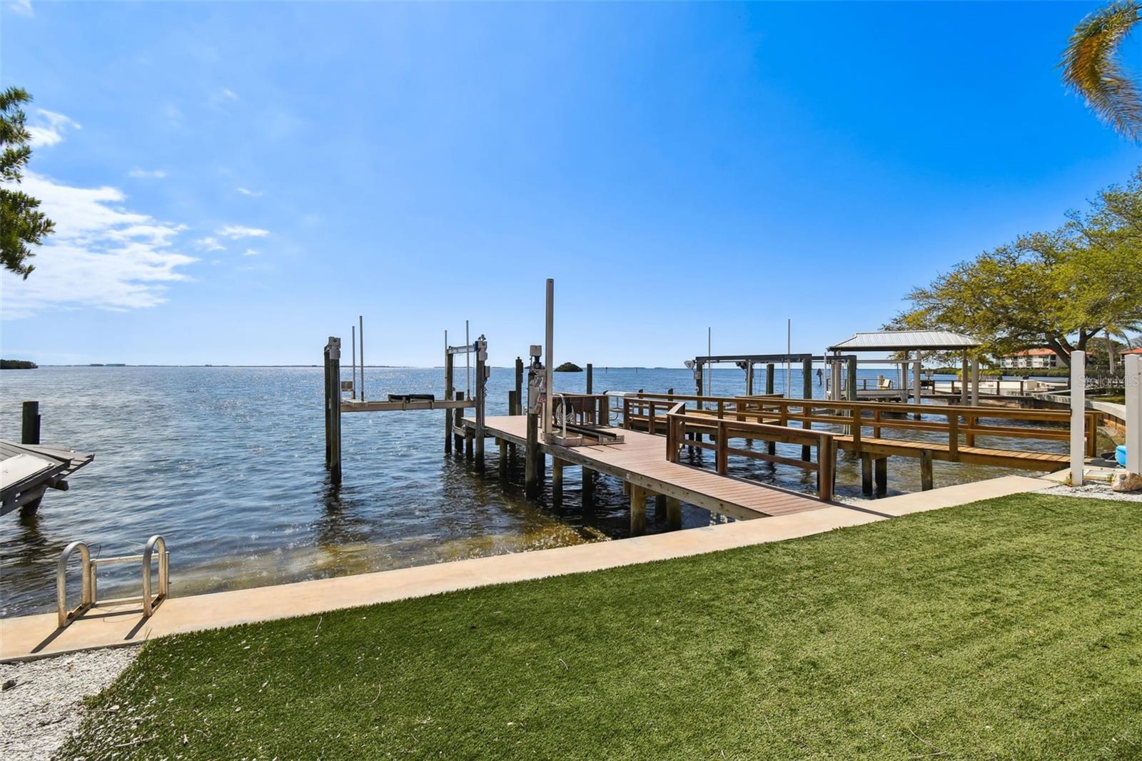 Private dock with electric & water.  Artificial turf.