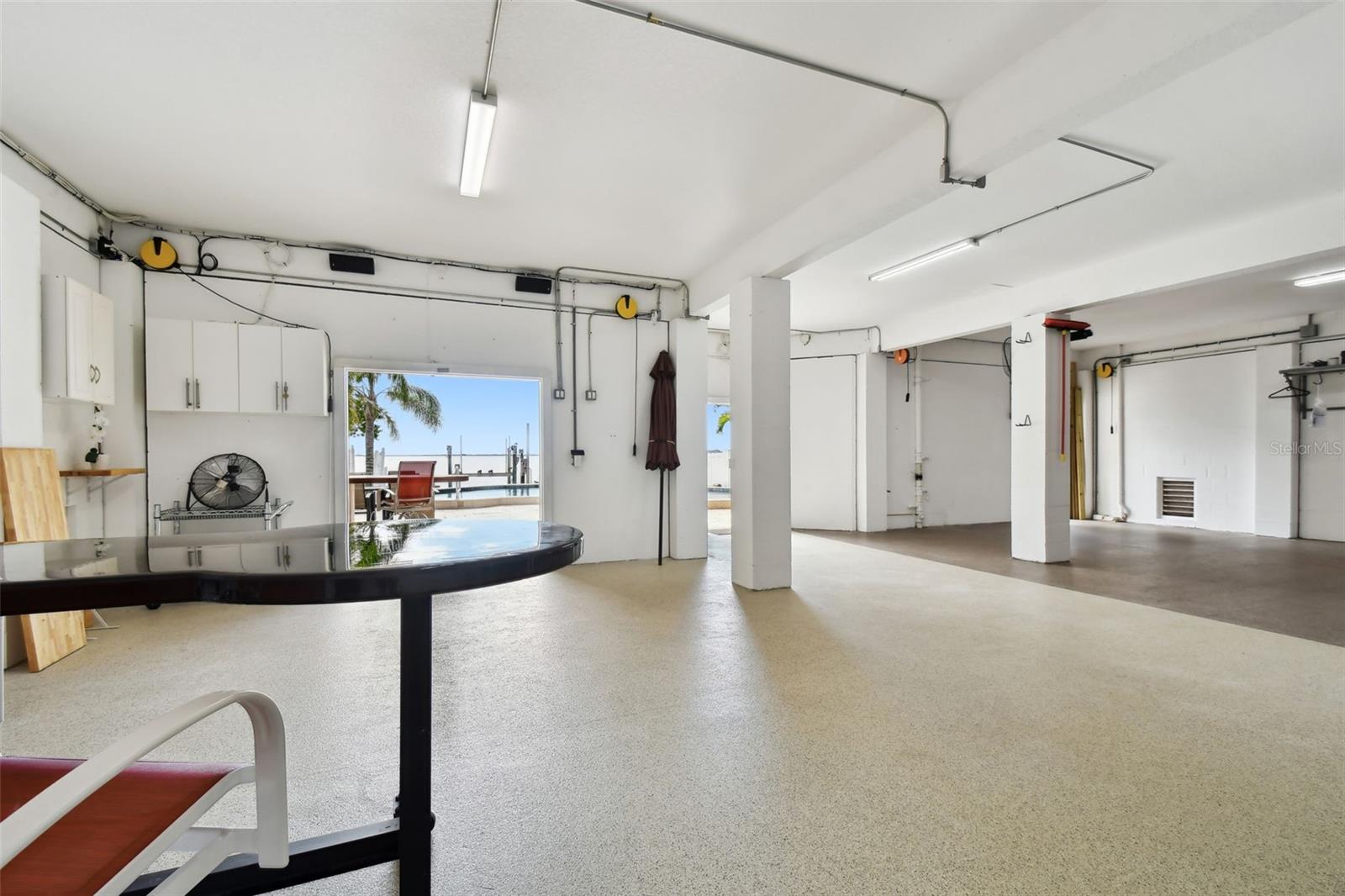 Ground floor garage opens to pool area