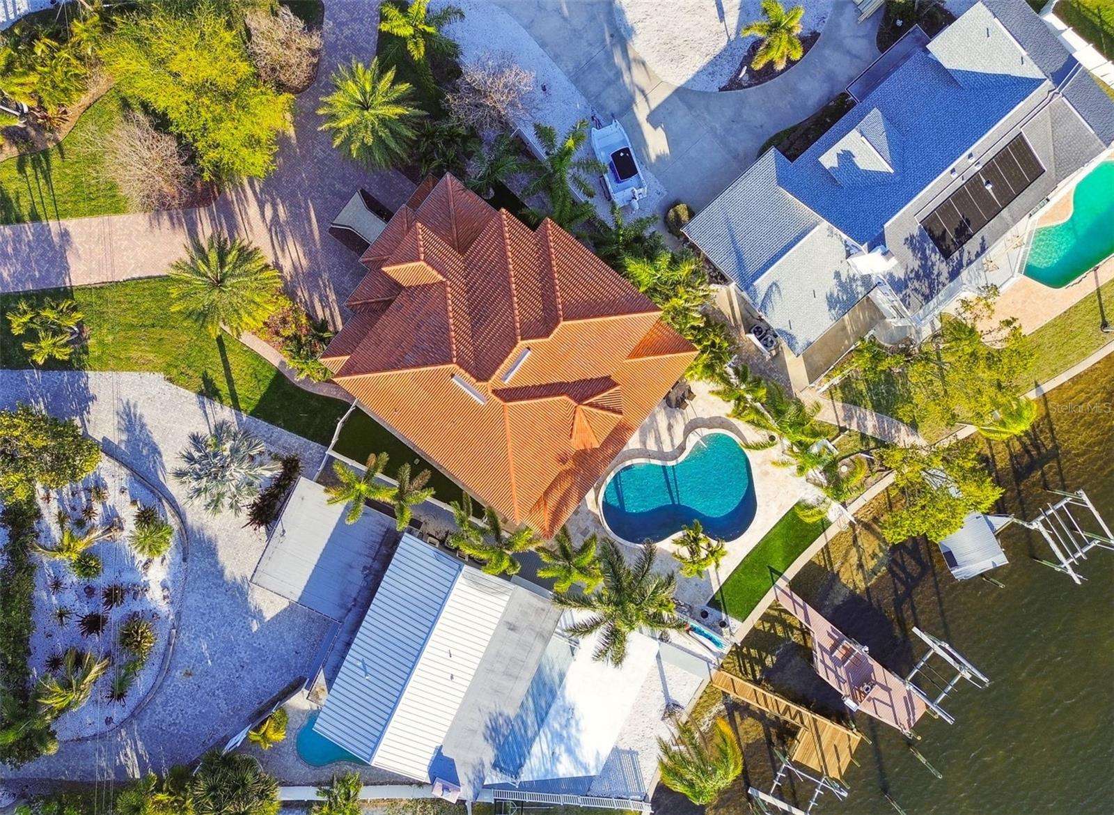Tile roof, lots of hardscaping
