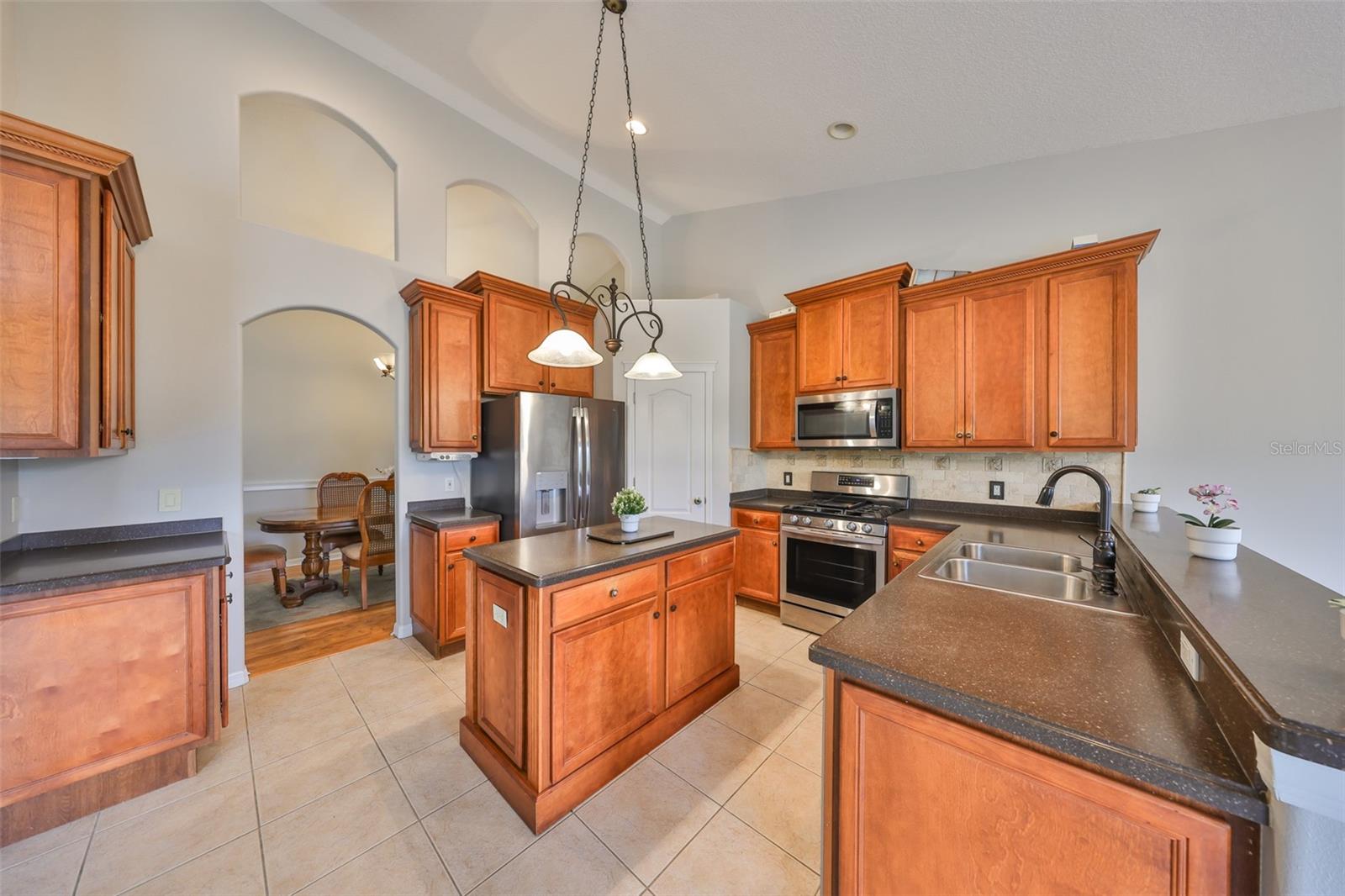 Corian Counters, Wood cabinets with beautiful crown molding