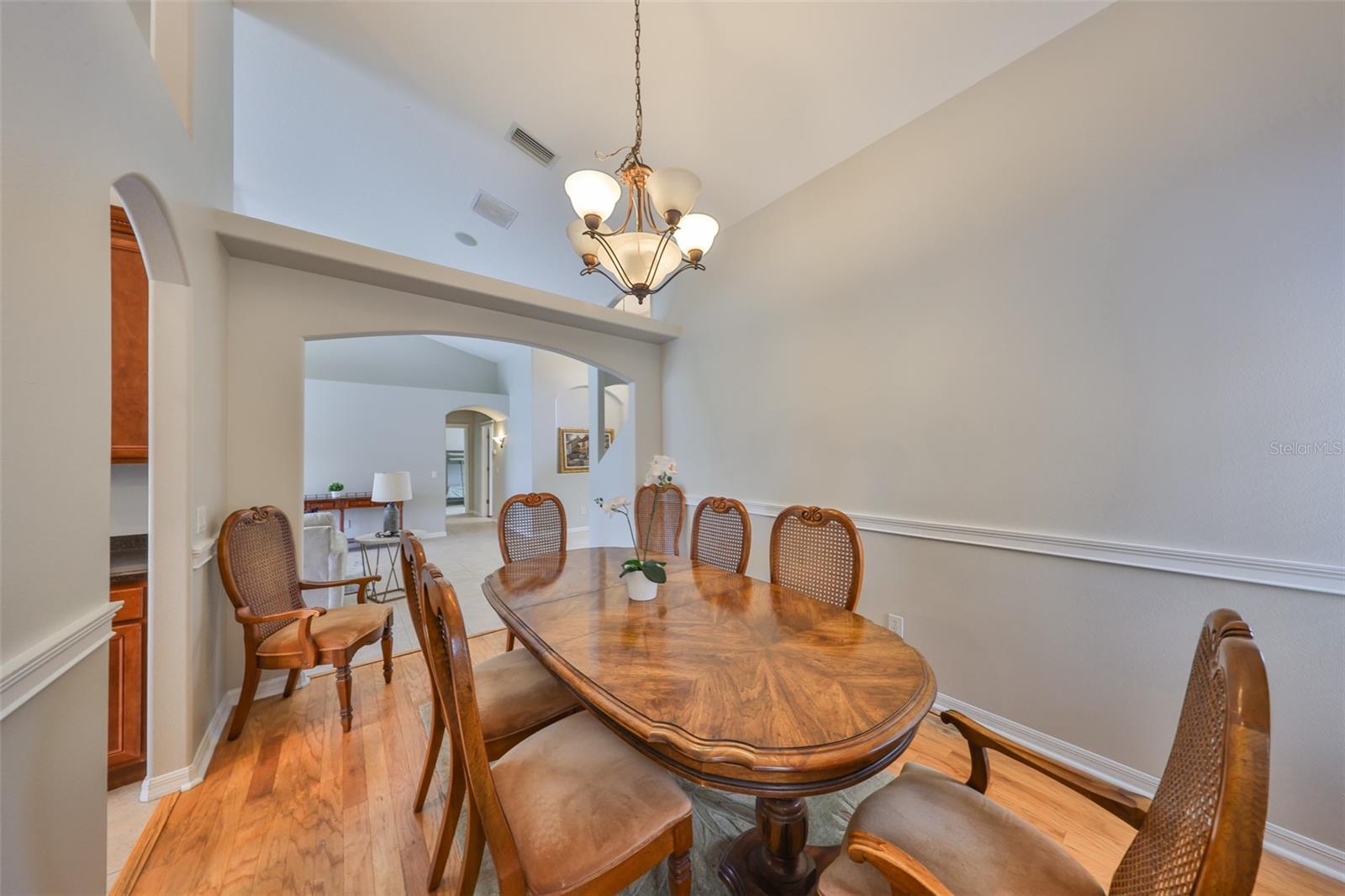 Formal dining room with wood floor