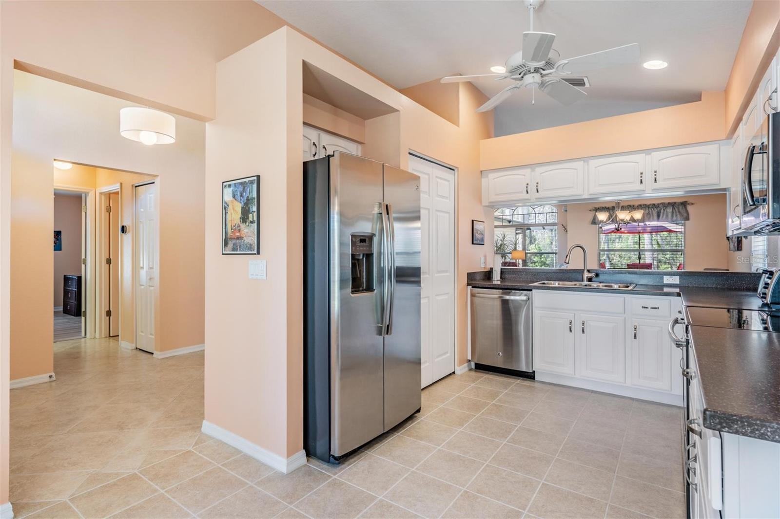 All stainless kitchen with large pantry