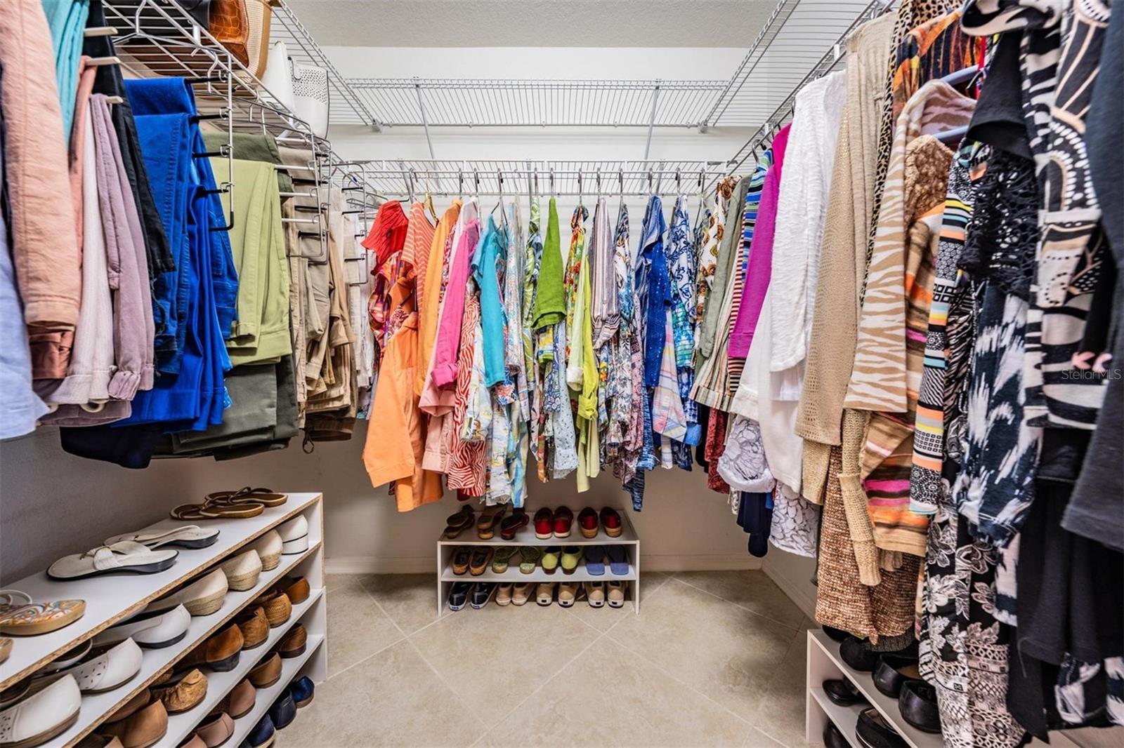 Walk-in closet with built-in ventilated shelving