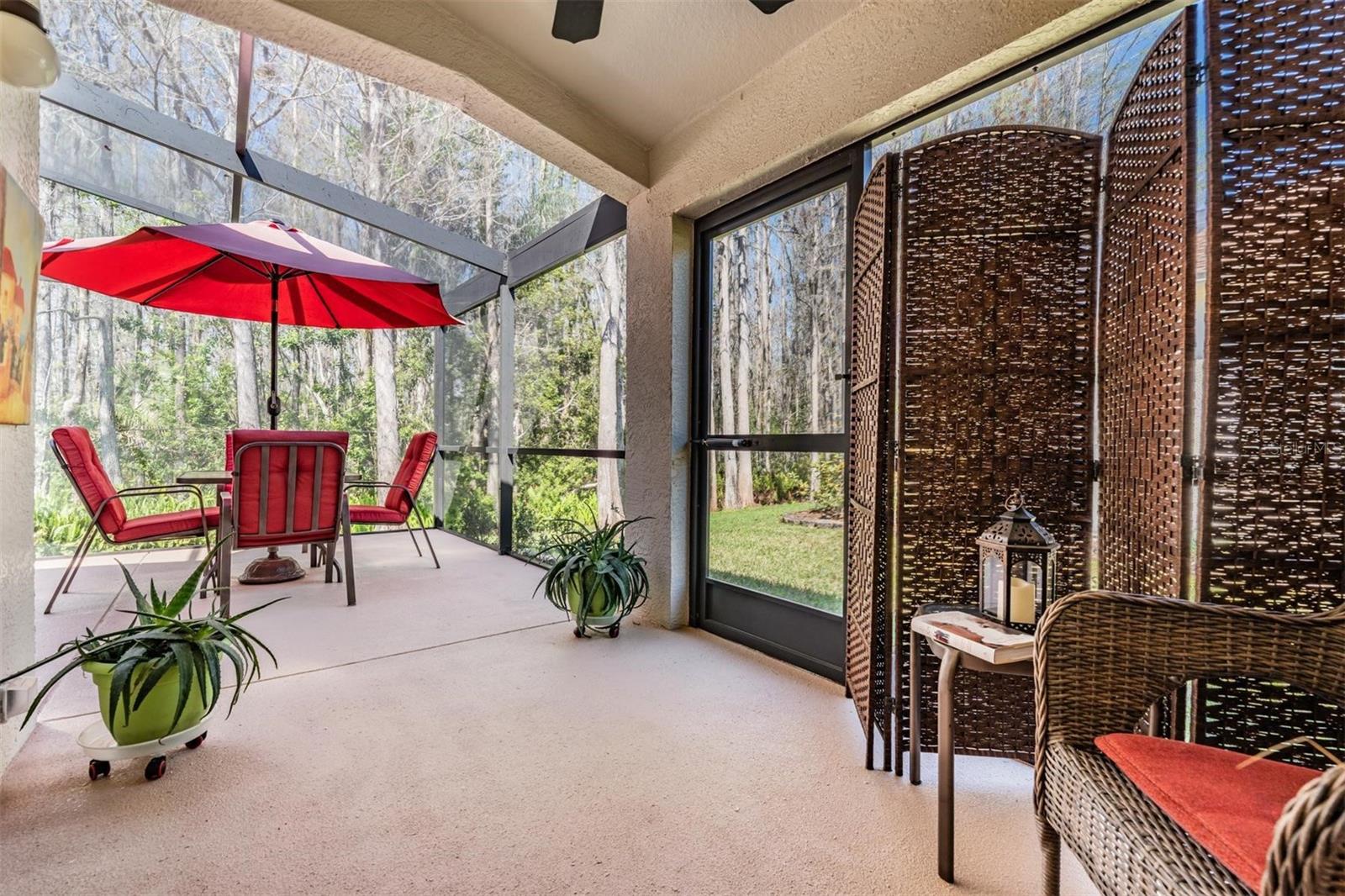 Covered conversation area for warmer days - also provides direct access from the lanai to the yard