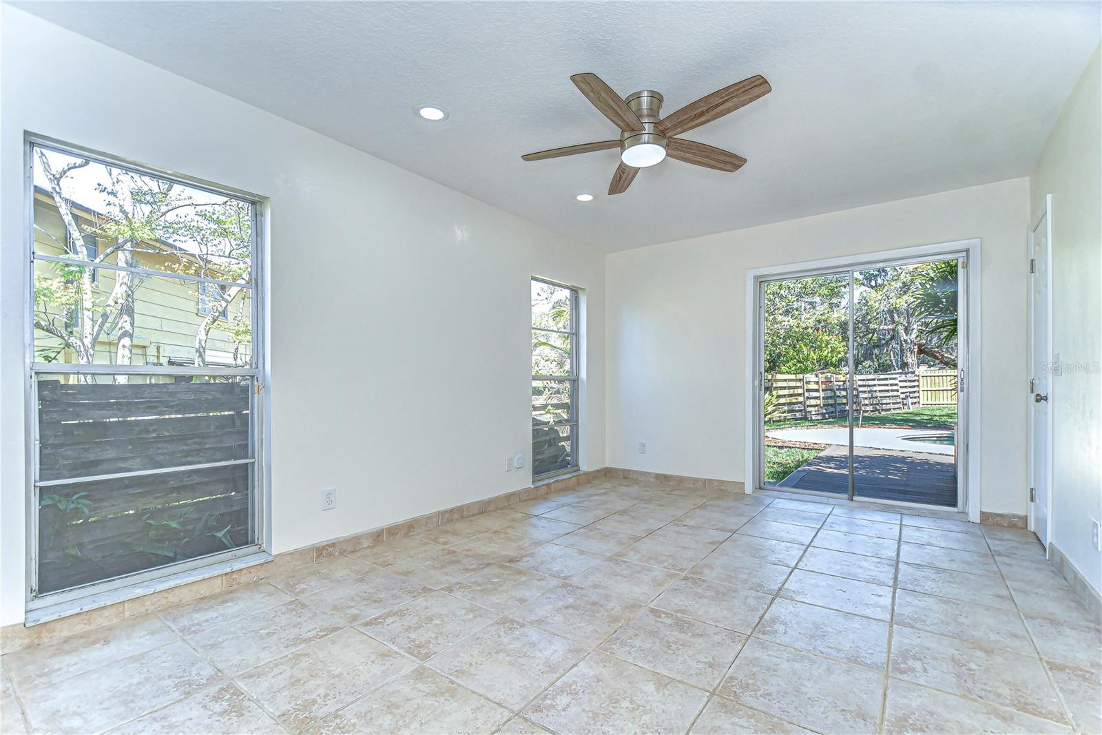 Welcome to your new enclave of tranquility, where this bright, airy bedroom invites endless possibilities for relaxation.