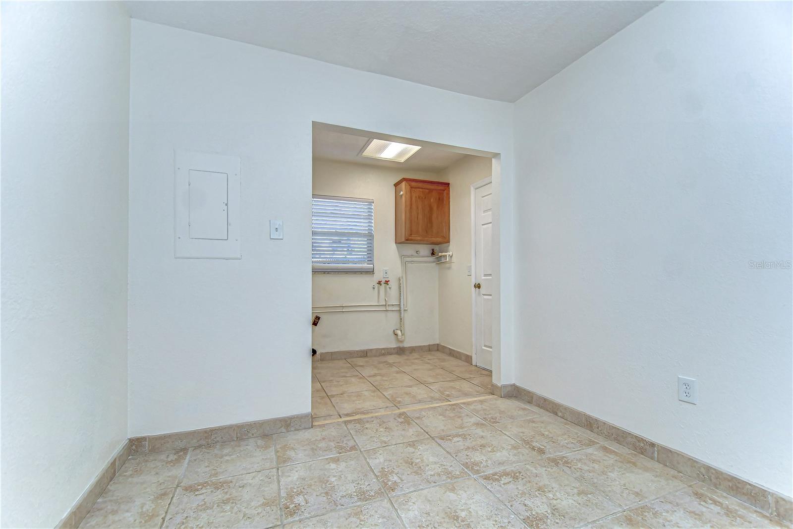 With pristine tile flooring and ample room, this area combines functionality with simplicity.