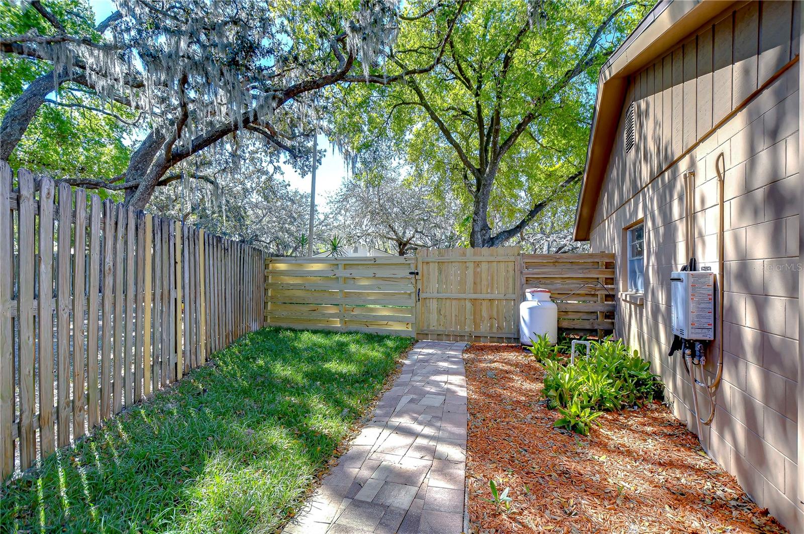 Step into this charming outdoor retreat where tranquility meets functionality.