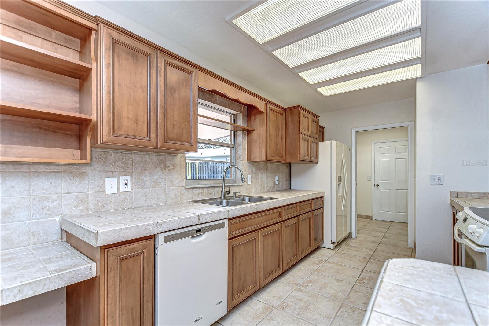 The classic tile backsplash and abundant natural light create the perfect balance of style and practicality.