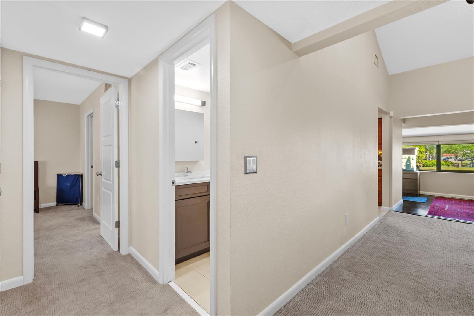 Hall view to guest bathroom and bonus area