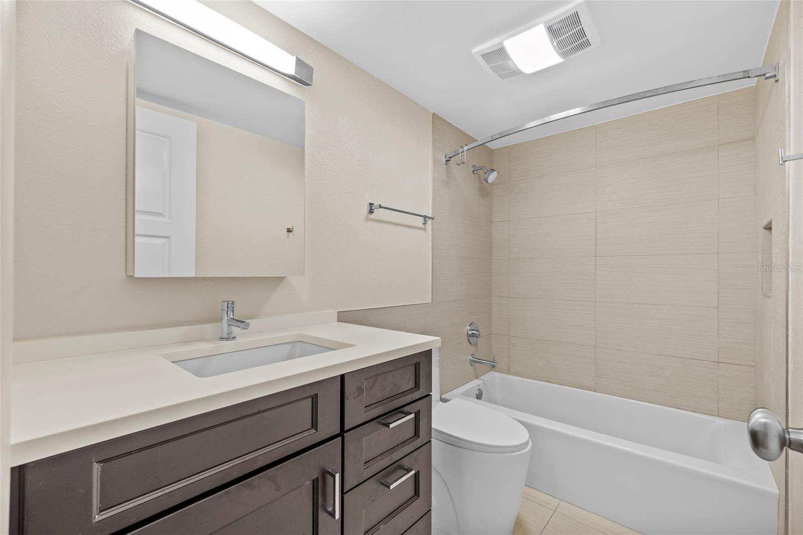 Guest bathroom lavatory and tub