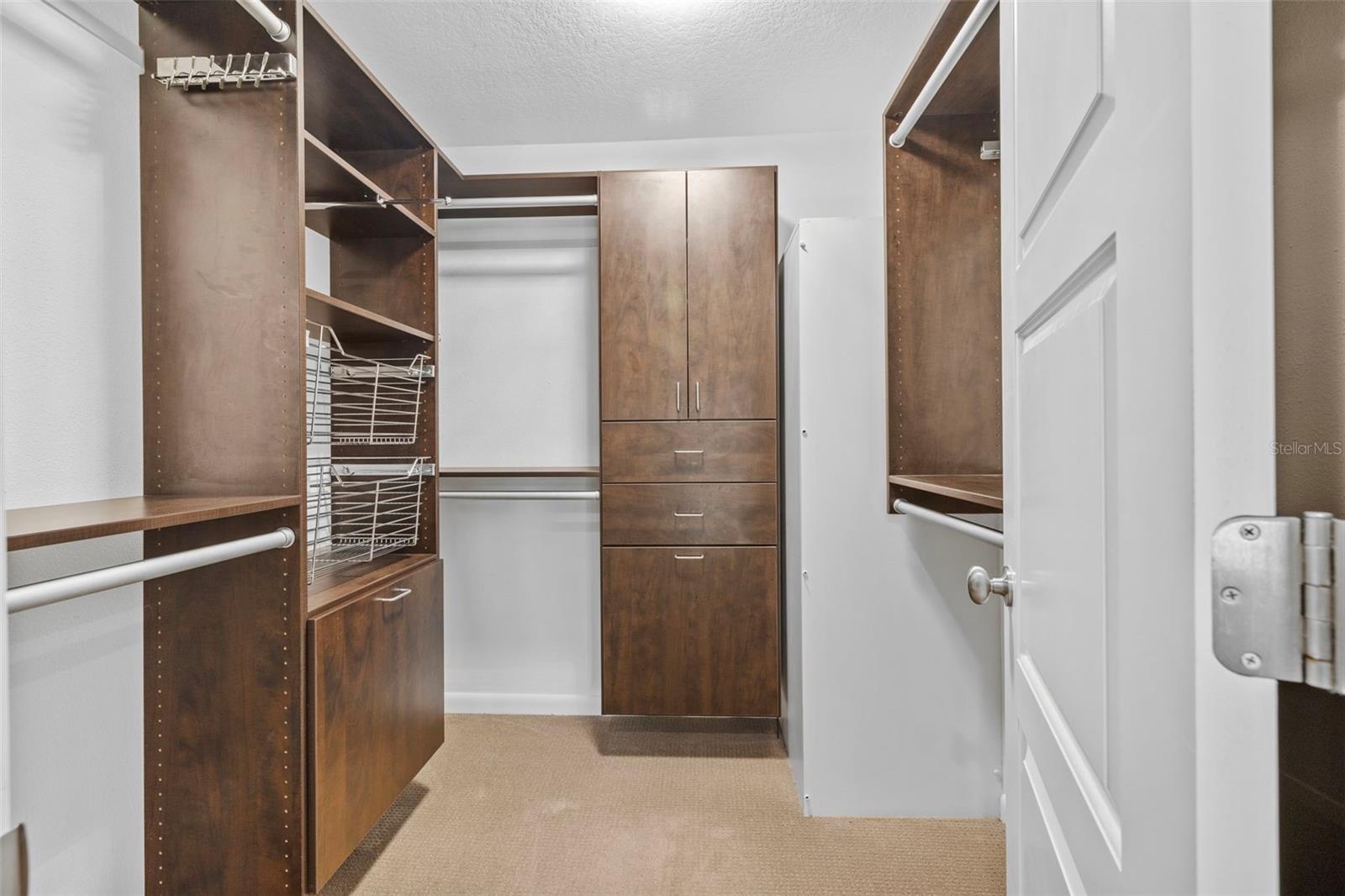 Primary bedroom walk-in closet