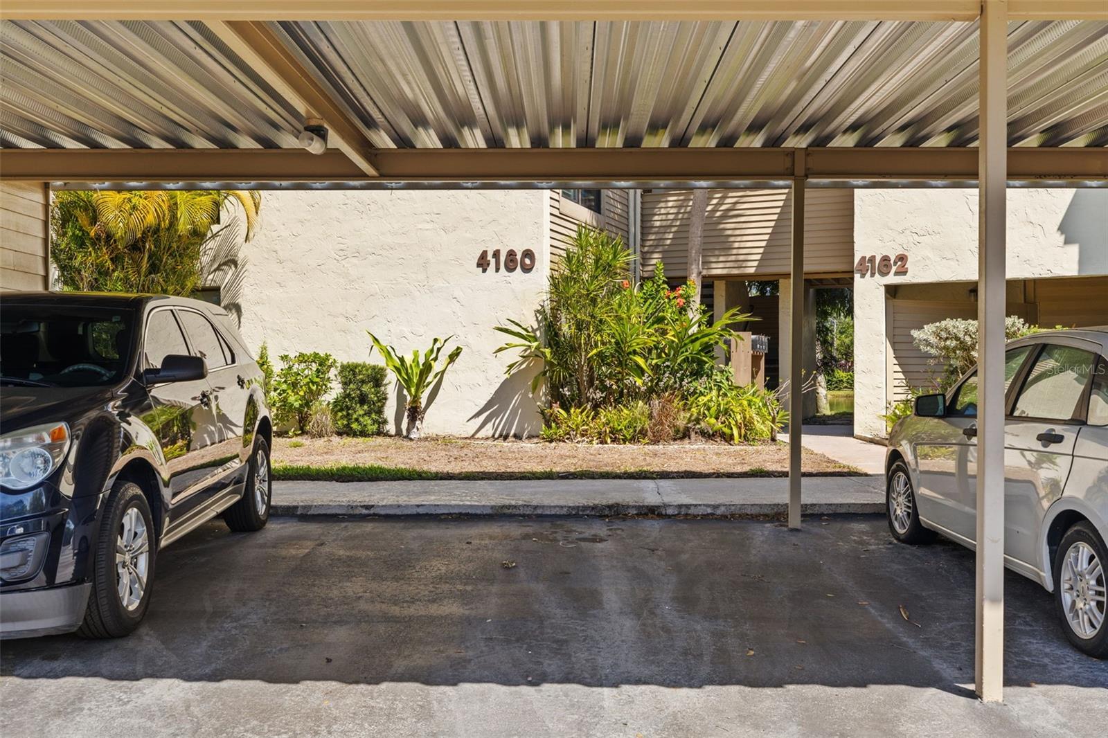 Dedicated parking space and mailbox in front of unit
