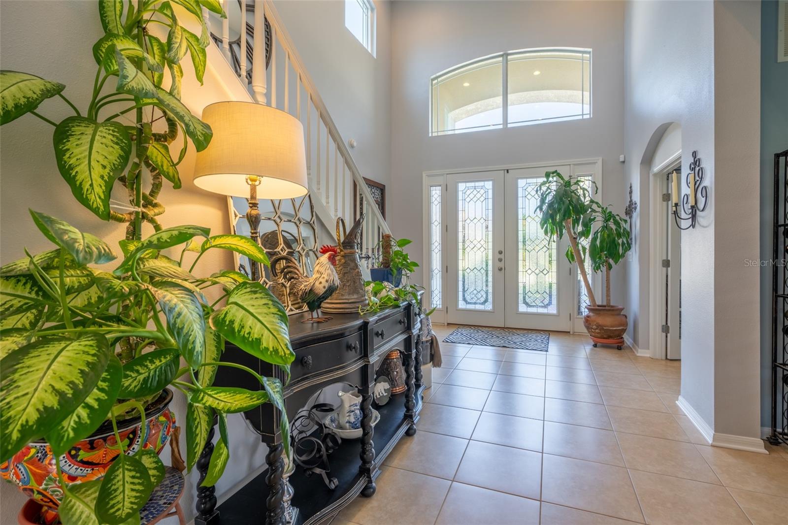 DOUBLE DOOR ENTRY W/TRANSOM OFFERING SO MUCH NATURAL LIGHT