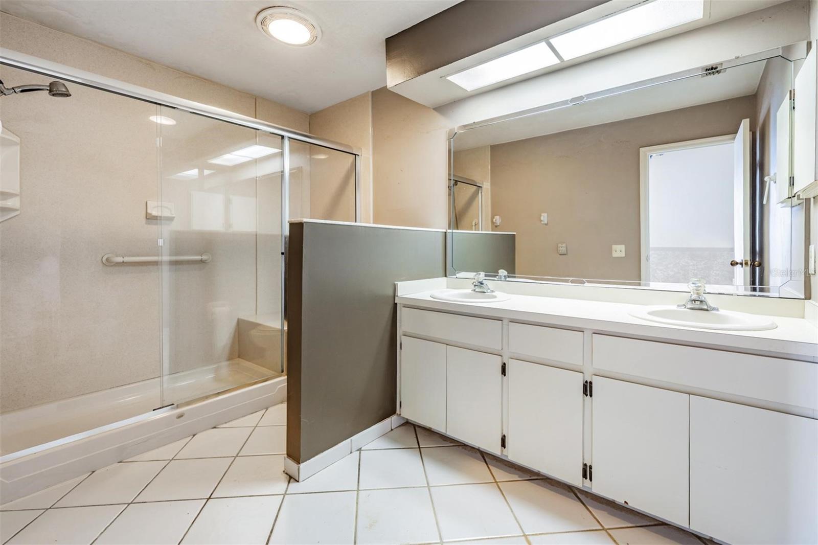 Primary bath with stand up shower and double sink vanity