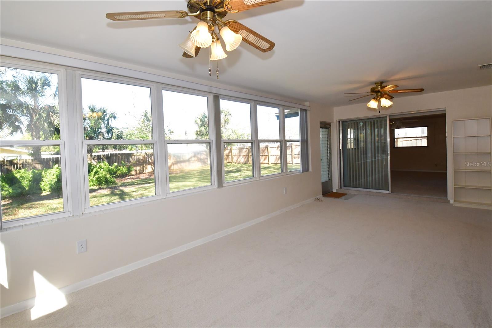 Living area and Sun room with patio access