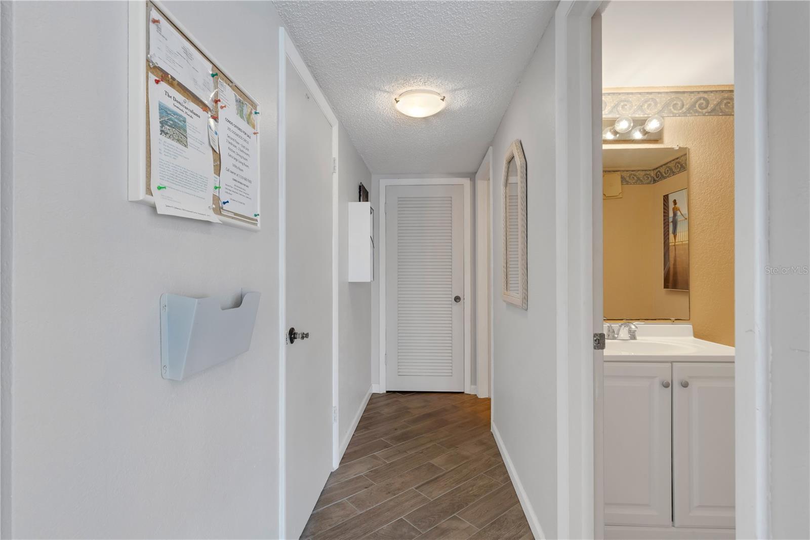 Hallway between laundry room & main clubhouse w/ bathrooms